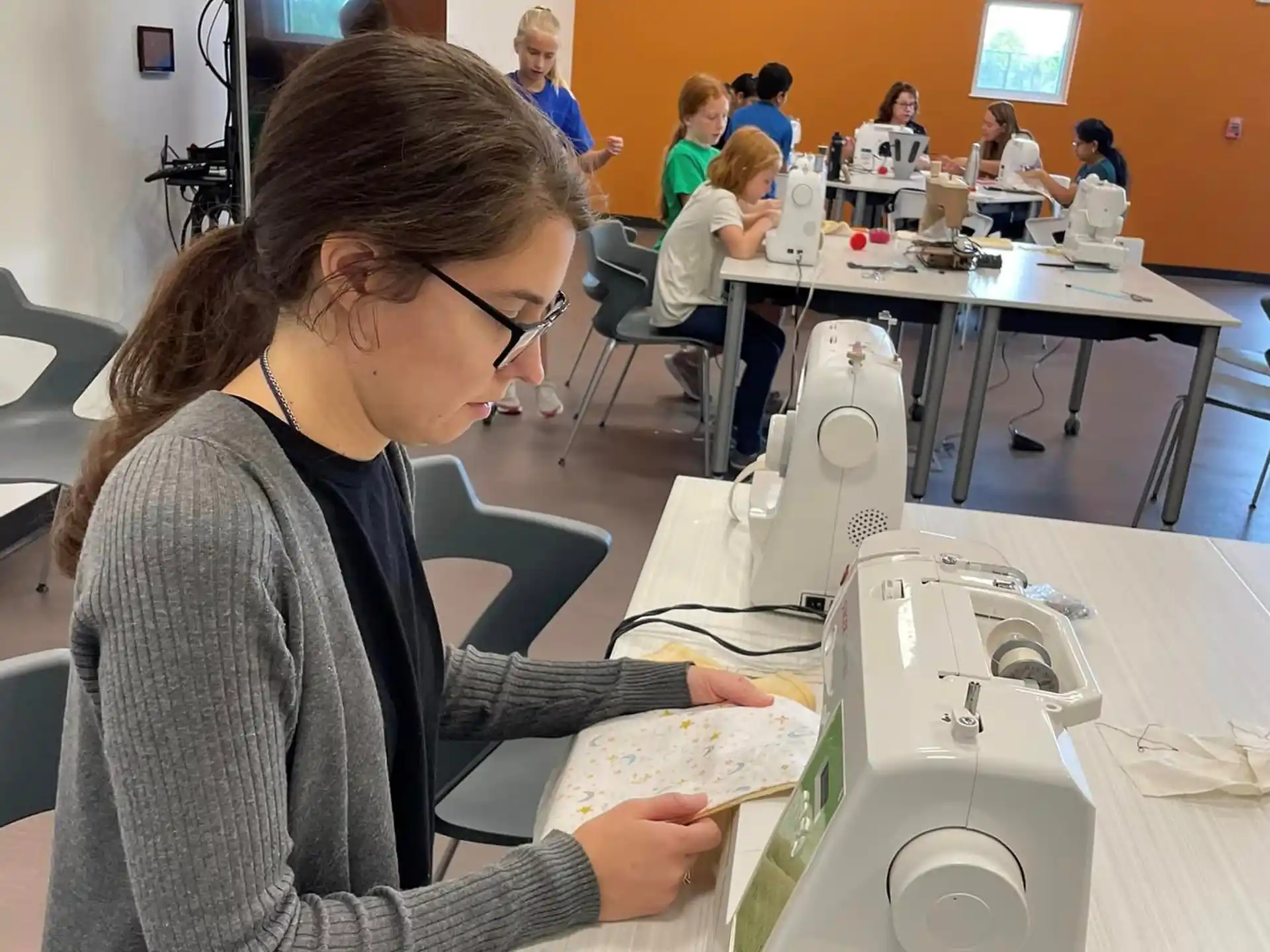 a woman using a microscope