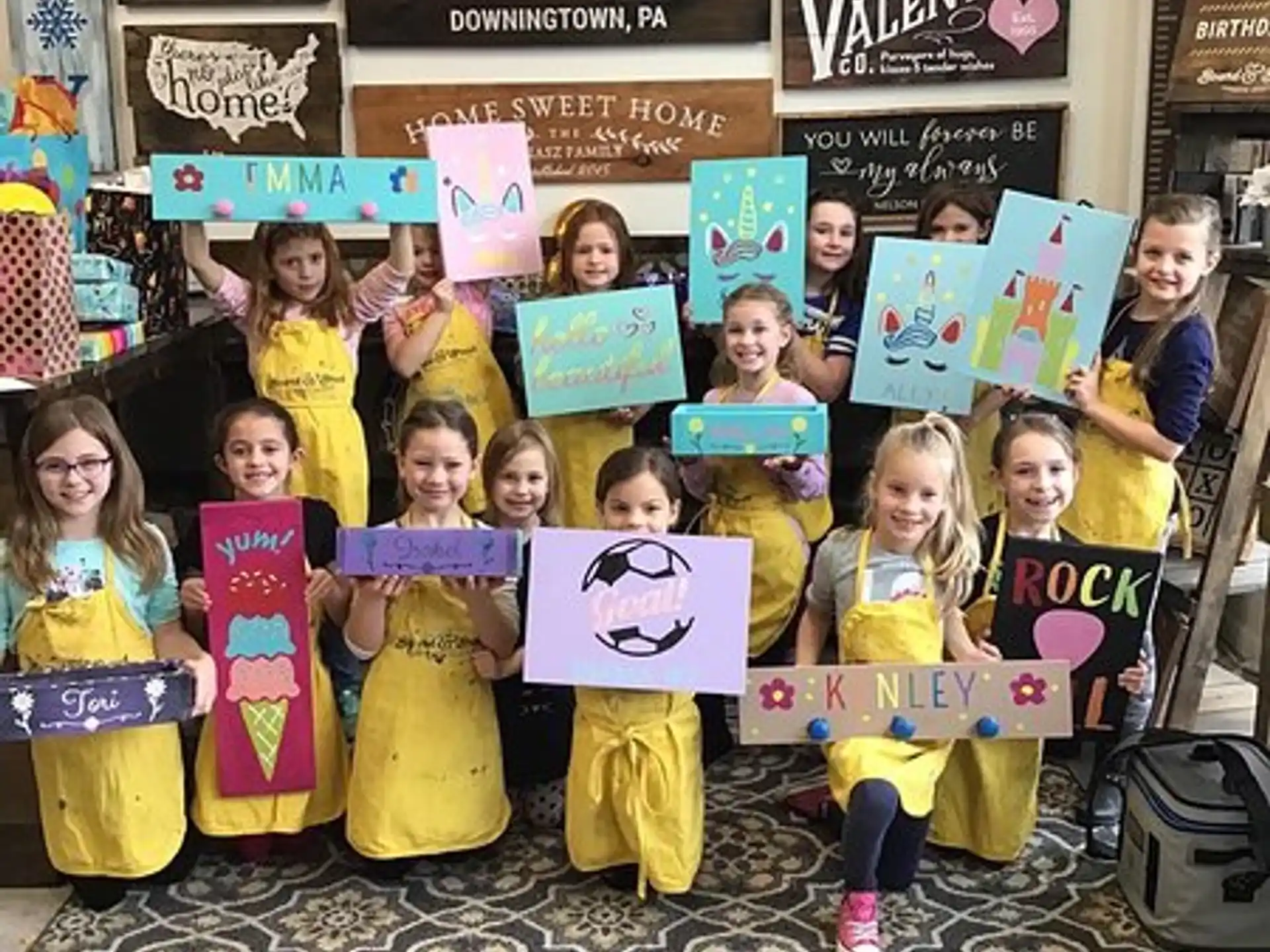 a group of children holding signs
