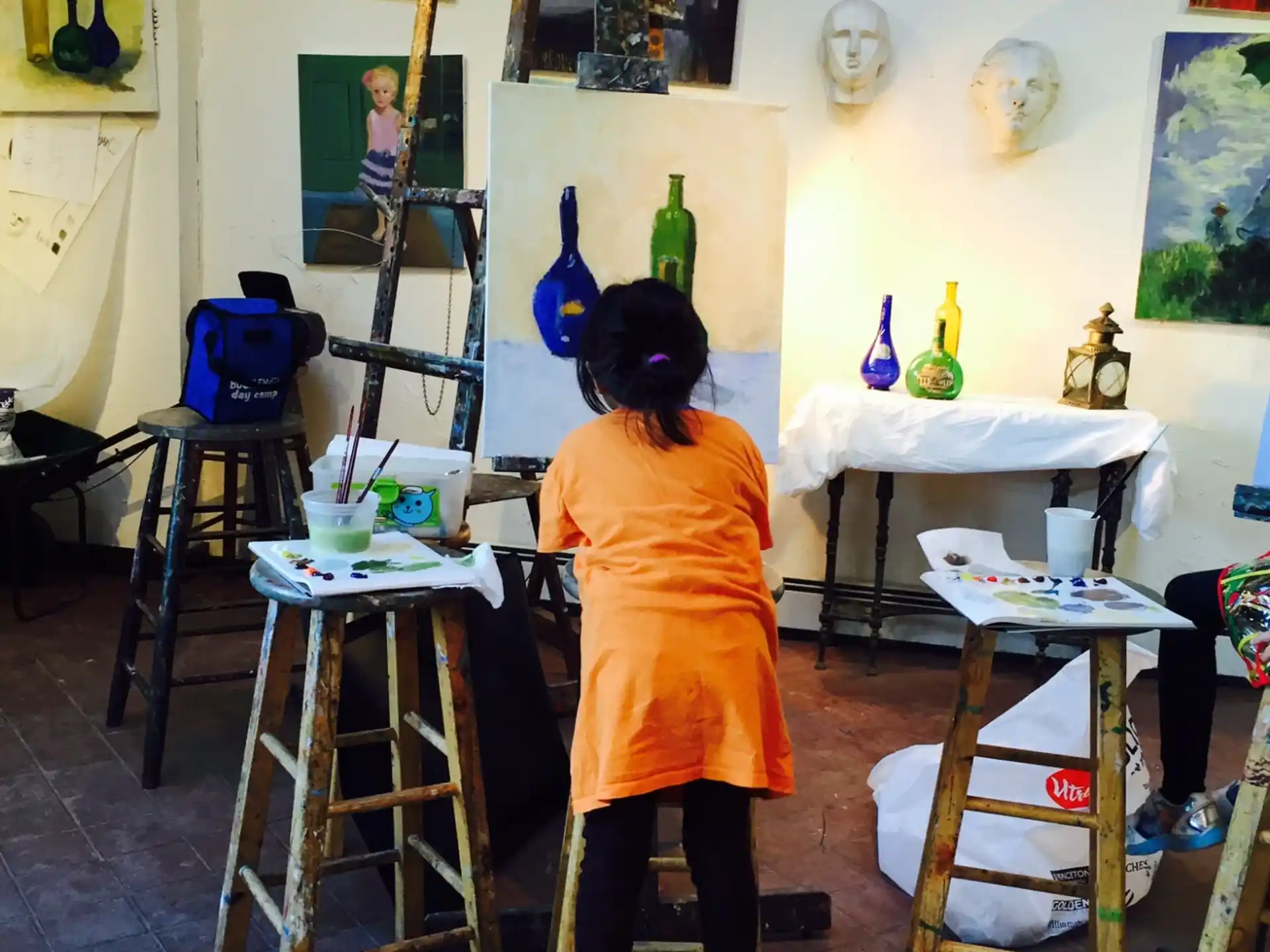 a child painting in a room