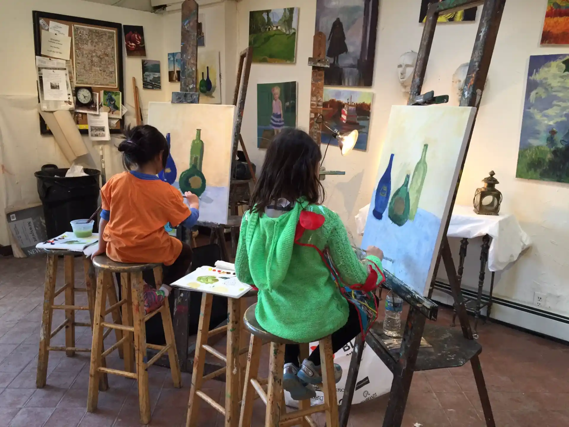 a couple of children painting