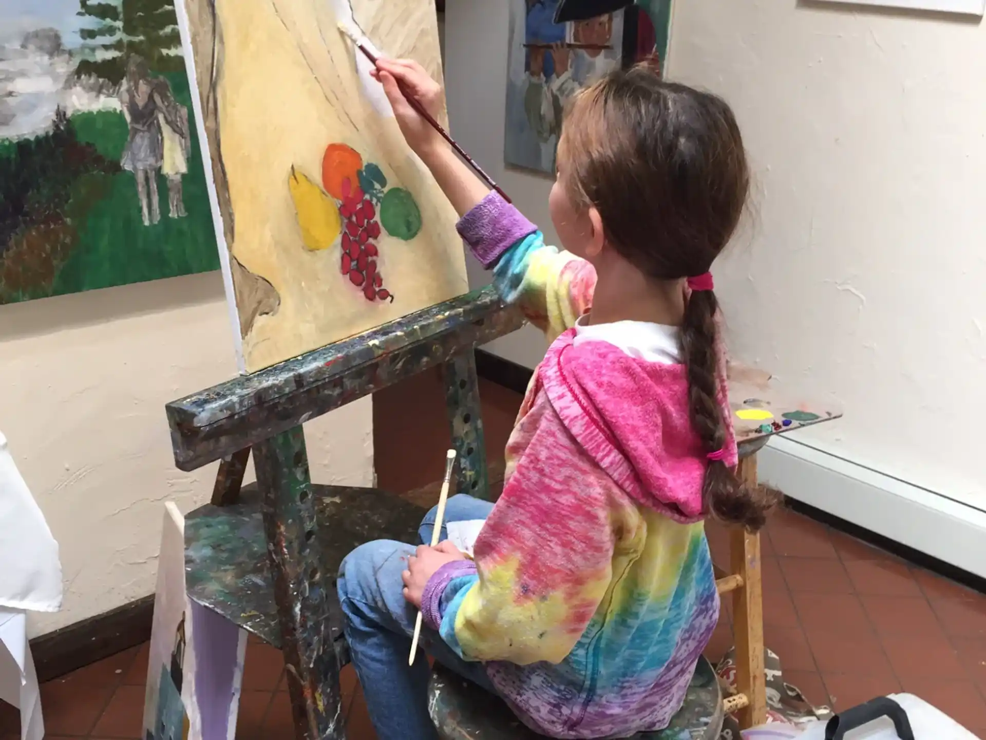 a young girl painting