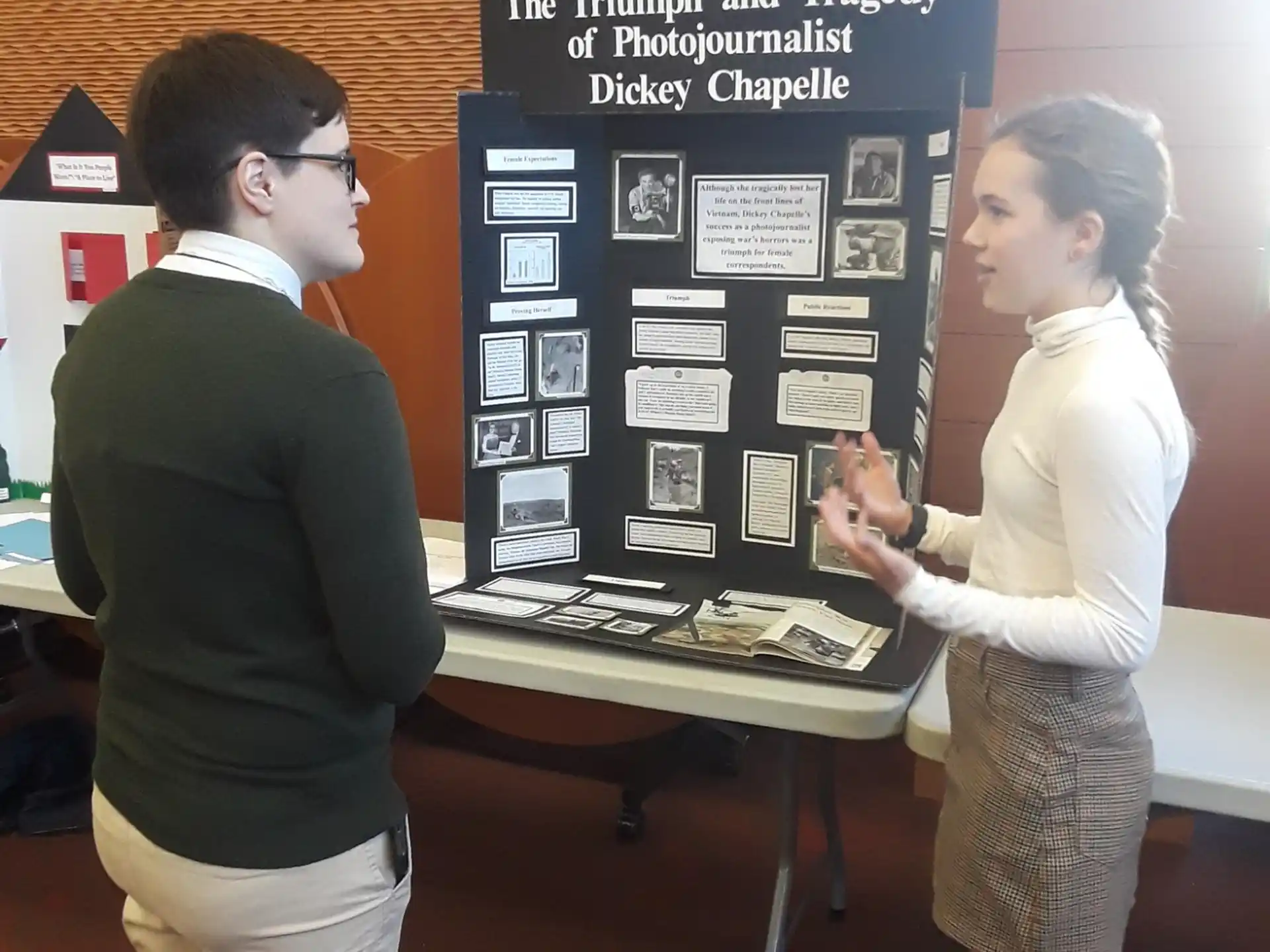 a man and a woman looking at a display