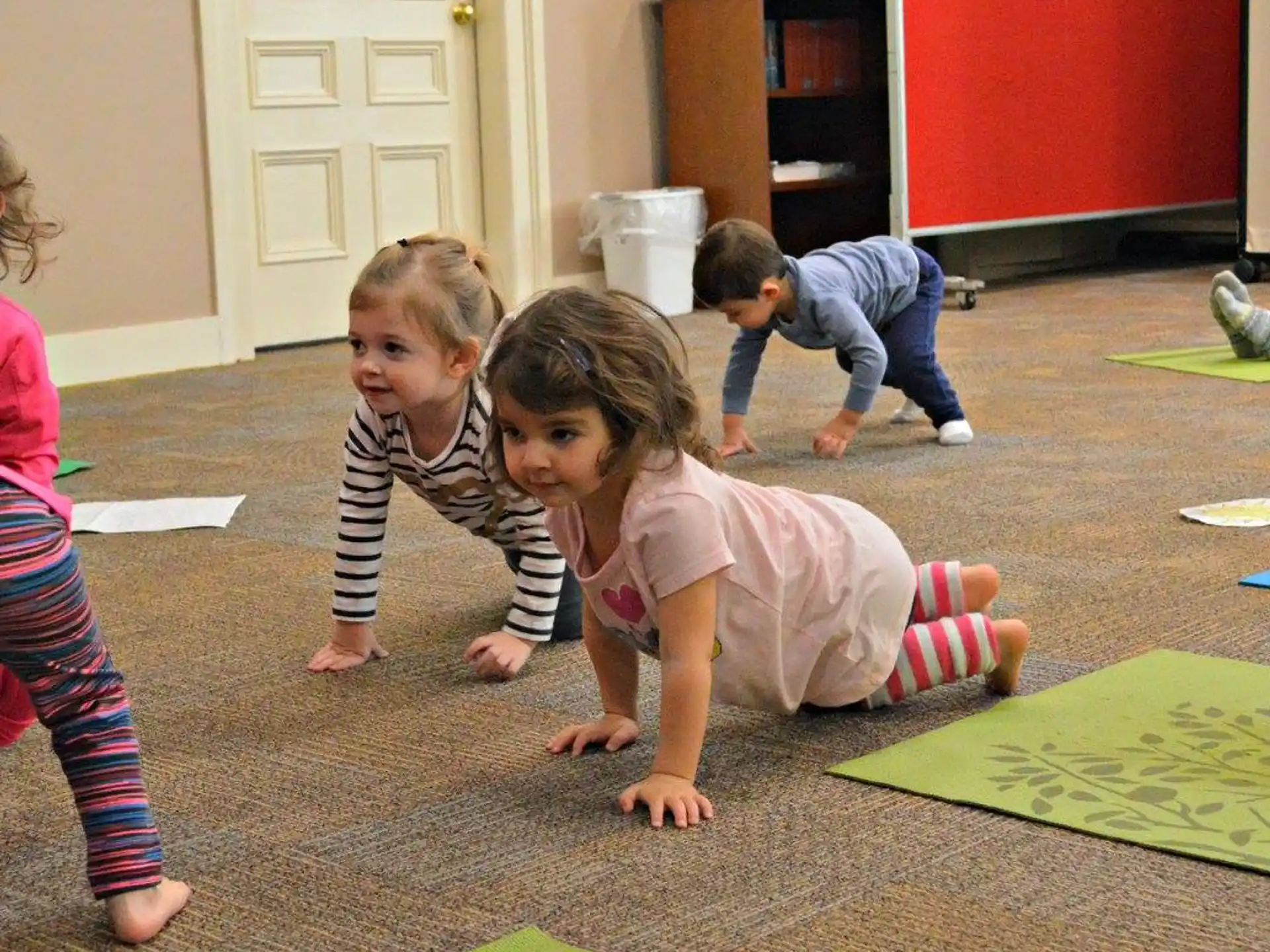 a group of children playing on the floor