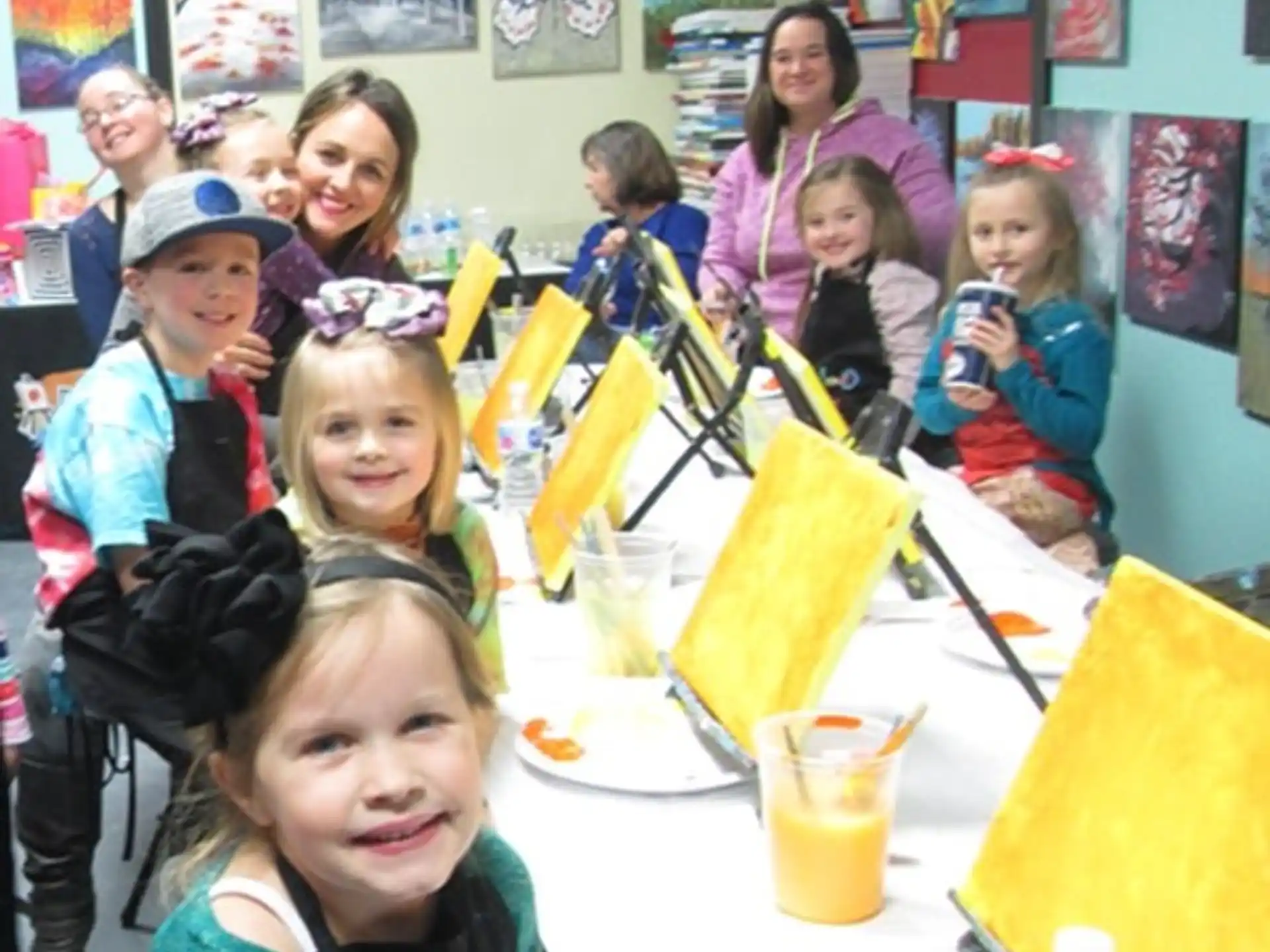 a group of children sitting at a table