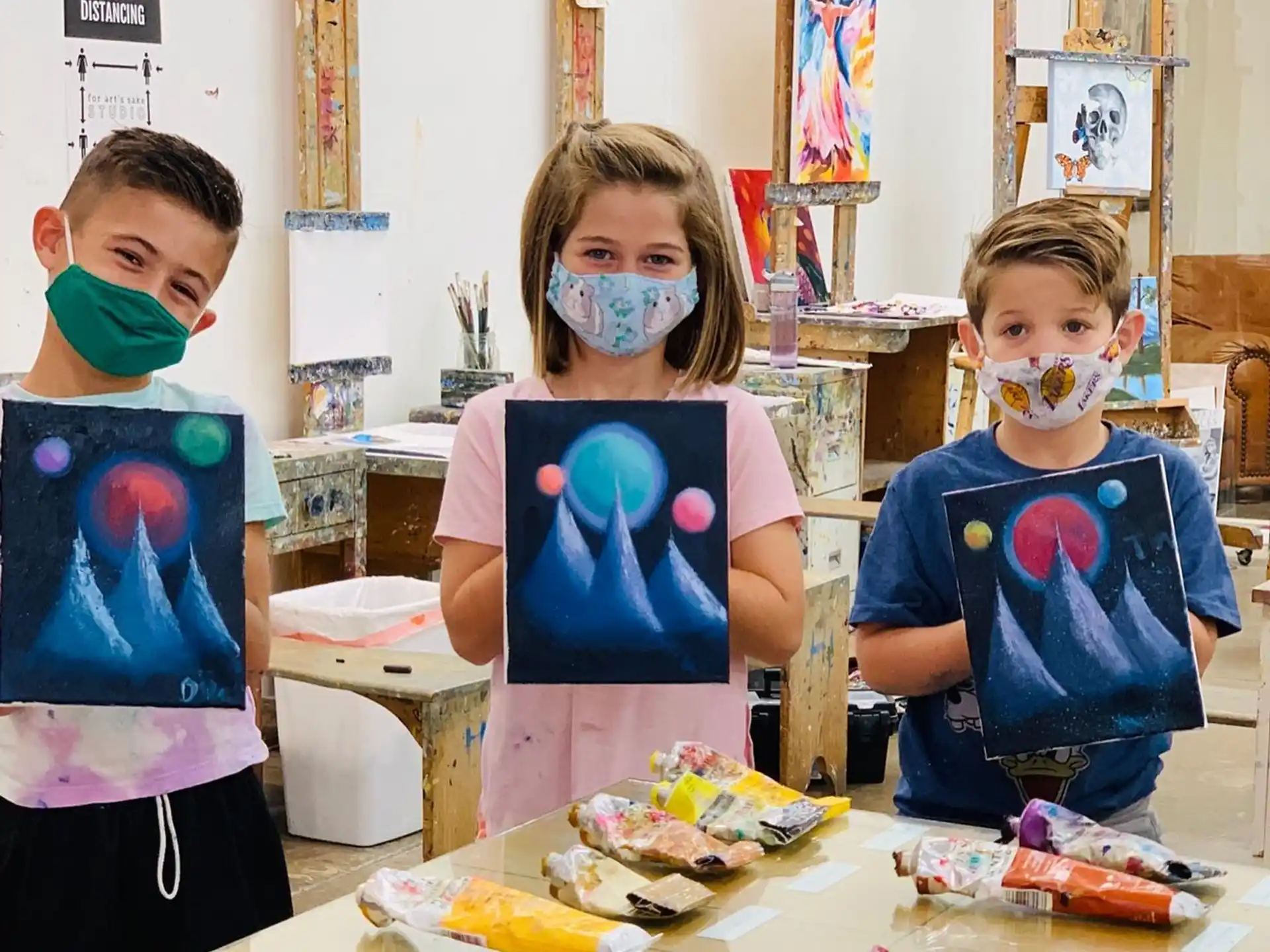 a group of children with face paint