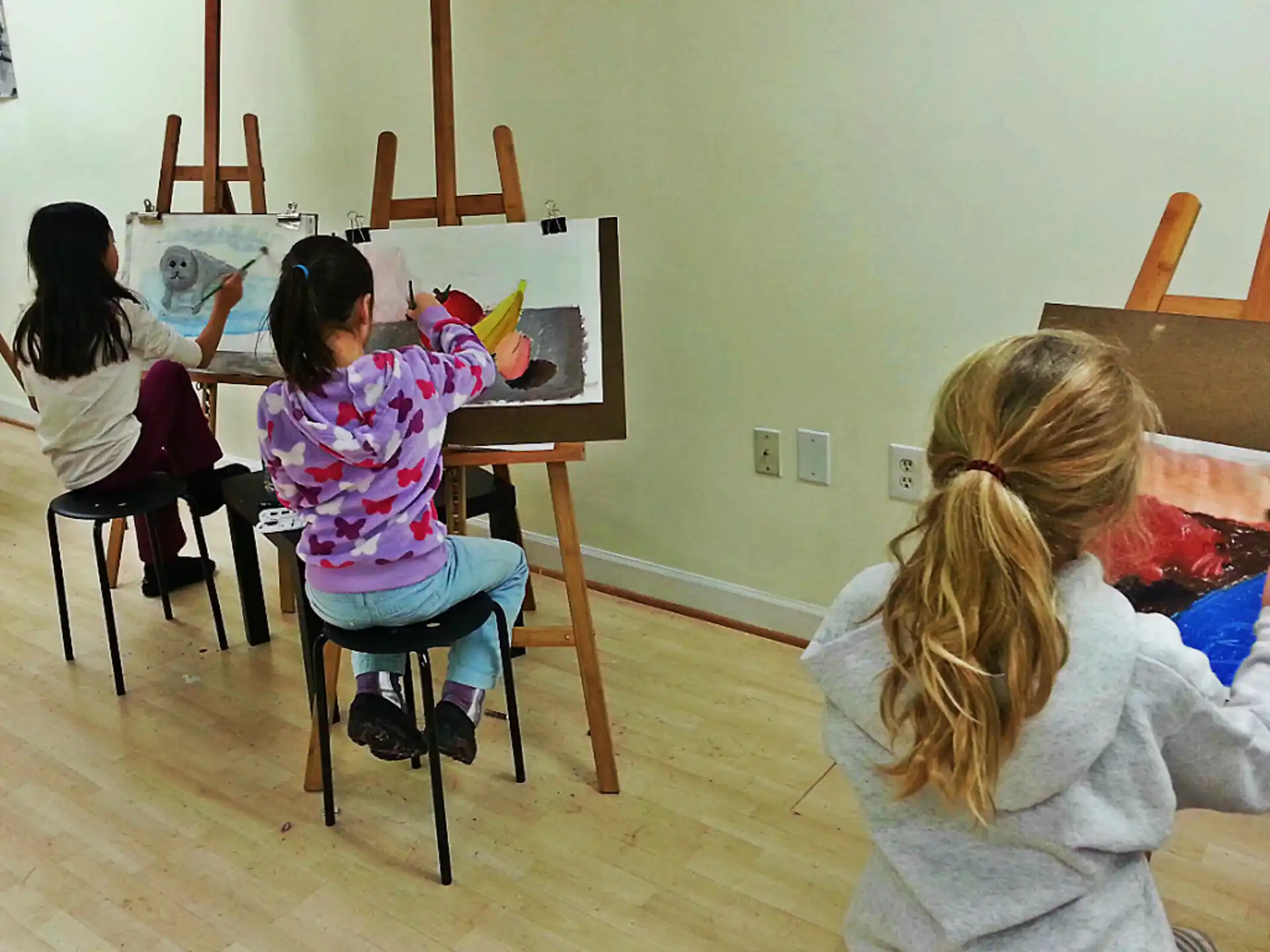 a group of children sitting in a classroom