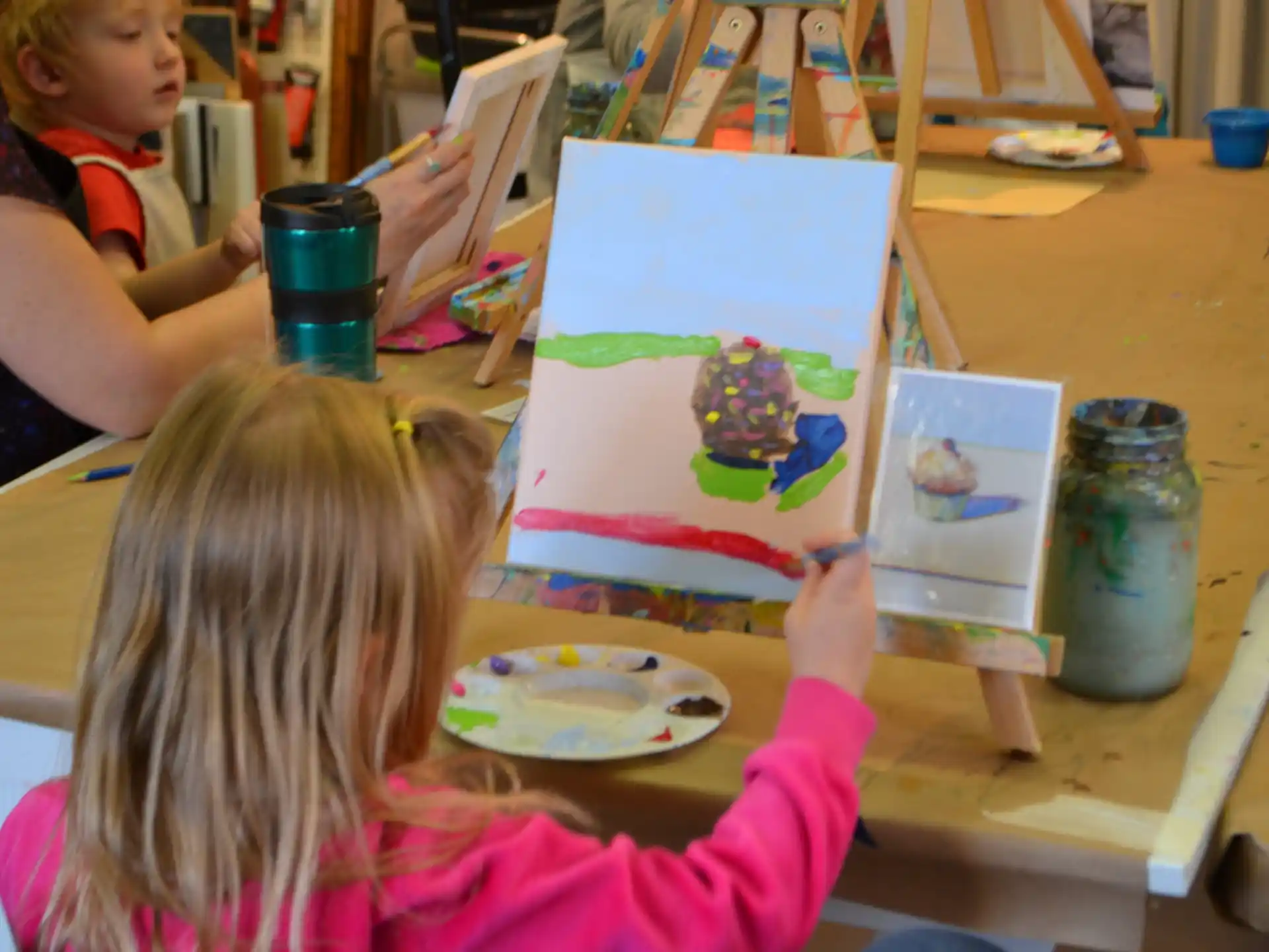 children painting on a table