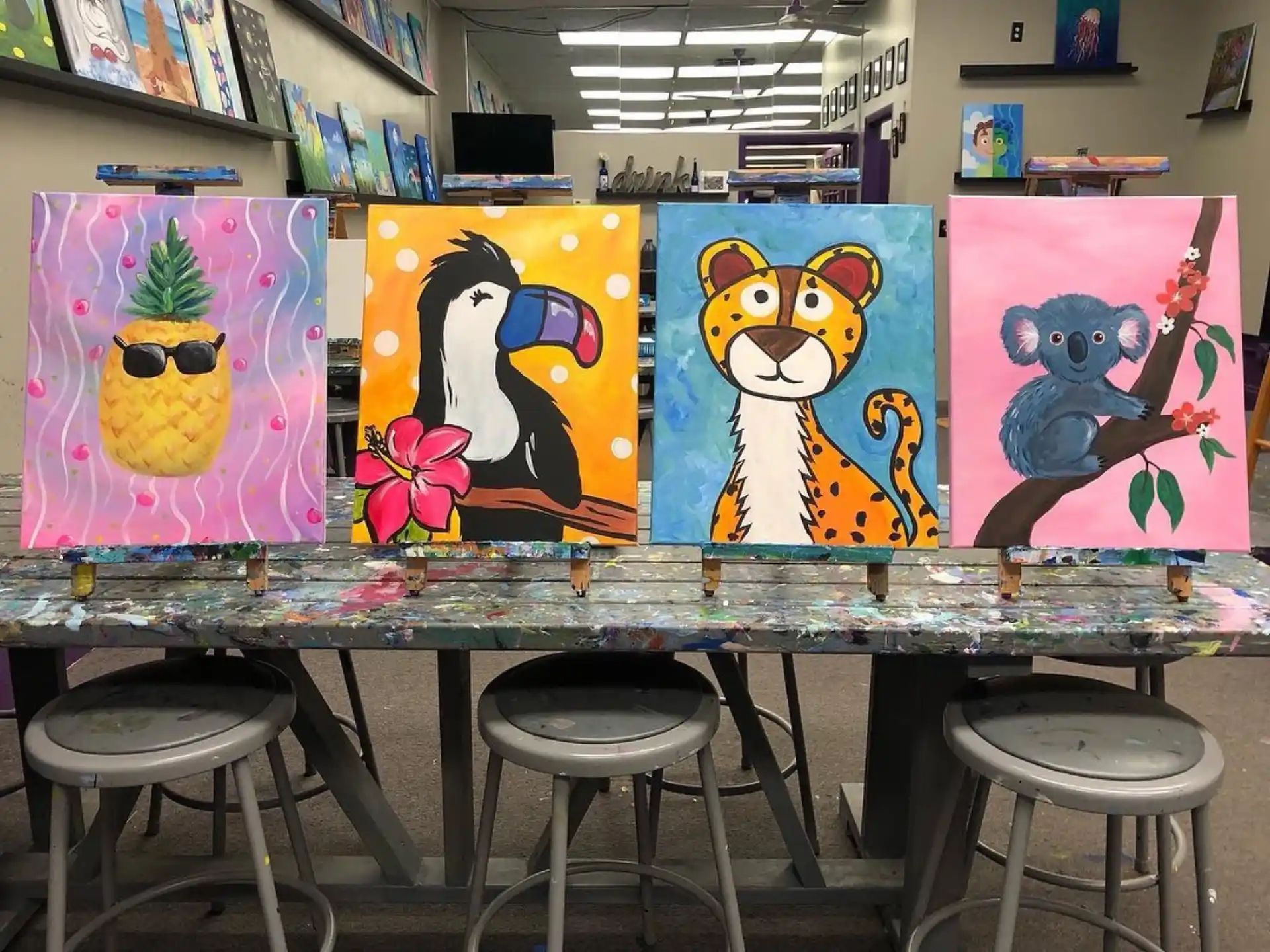 a table with stools and artwork