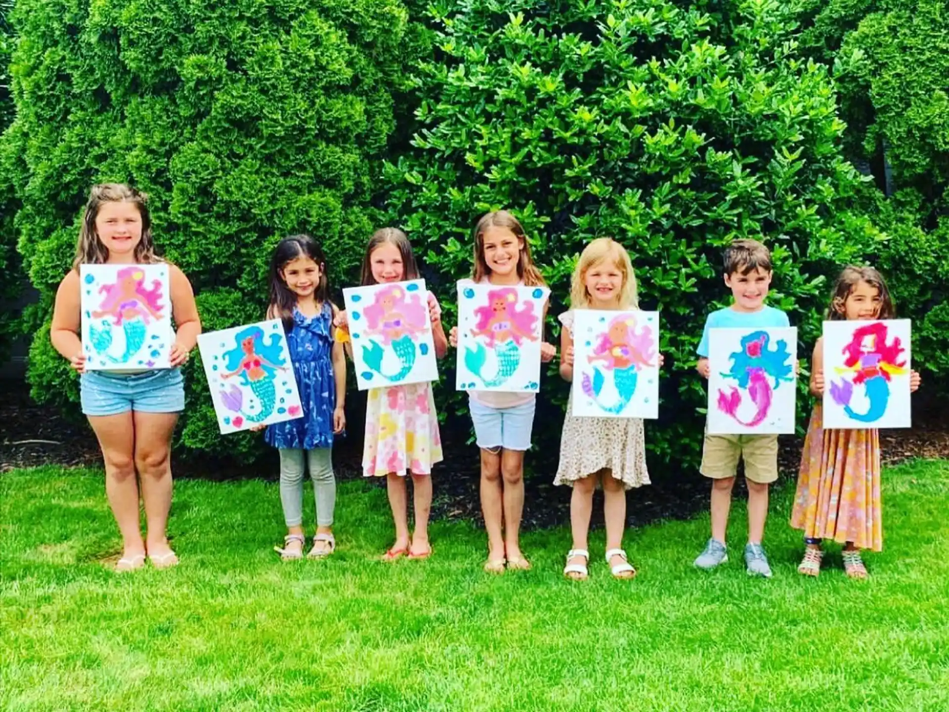 a group of children holding signs