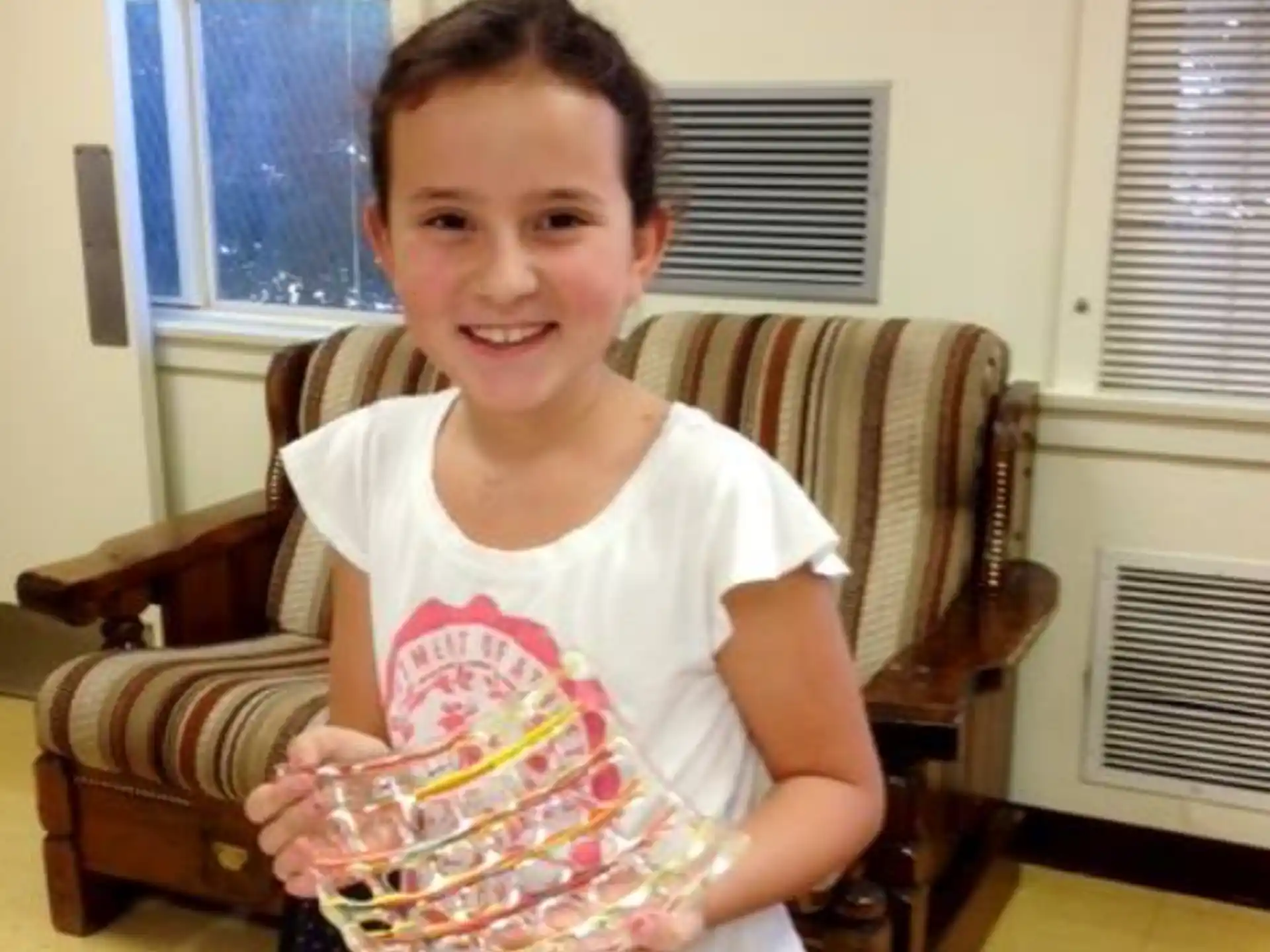 a girl sitting in a chair