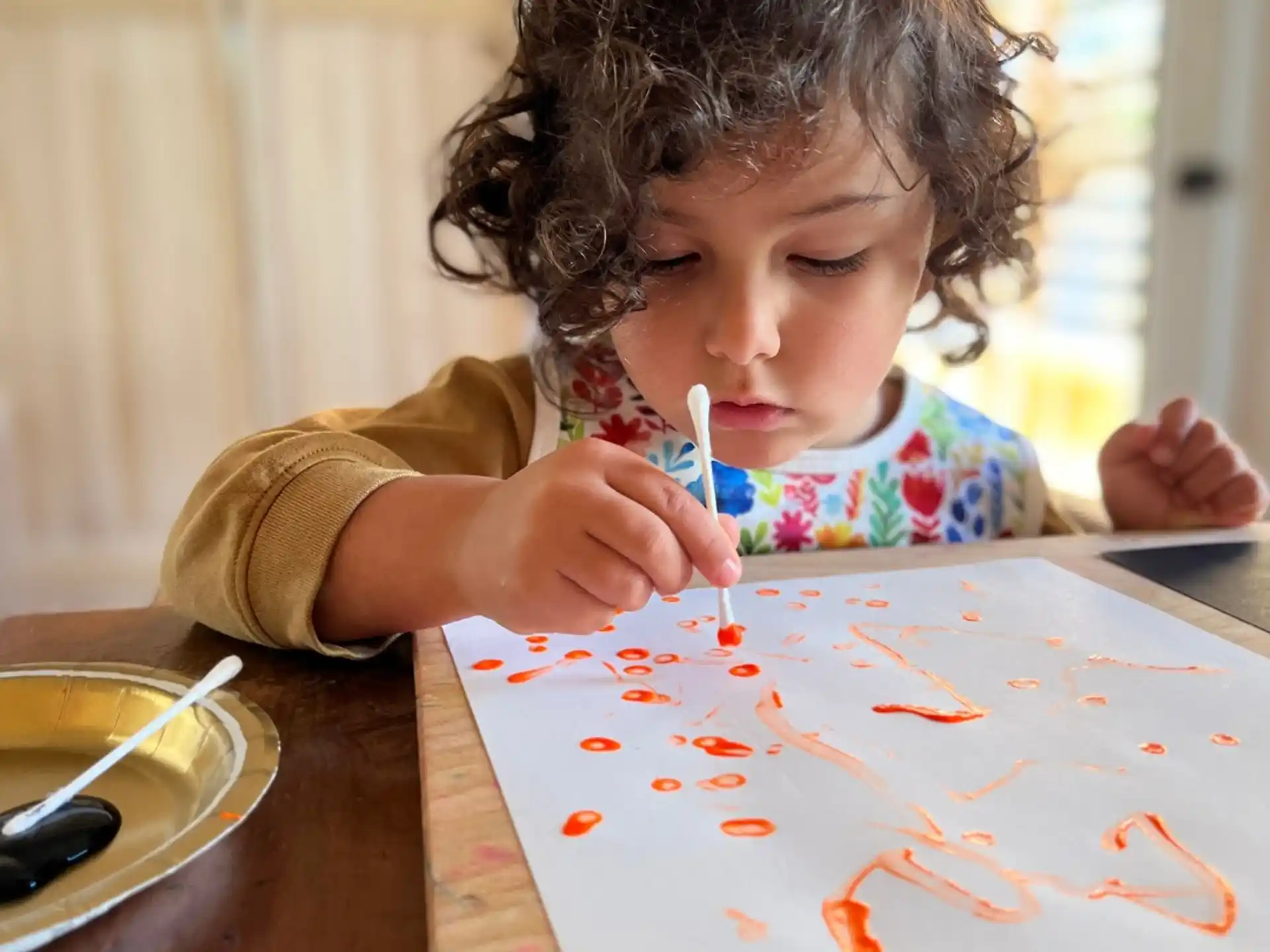 a young girl coloring on a paper