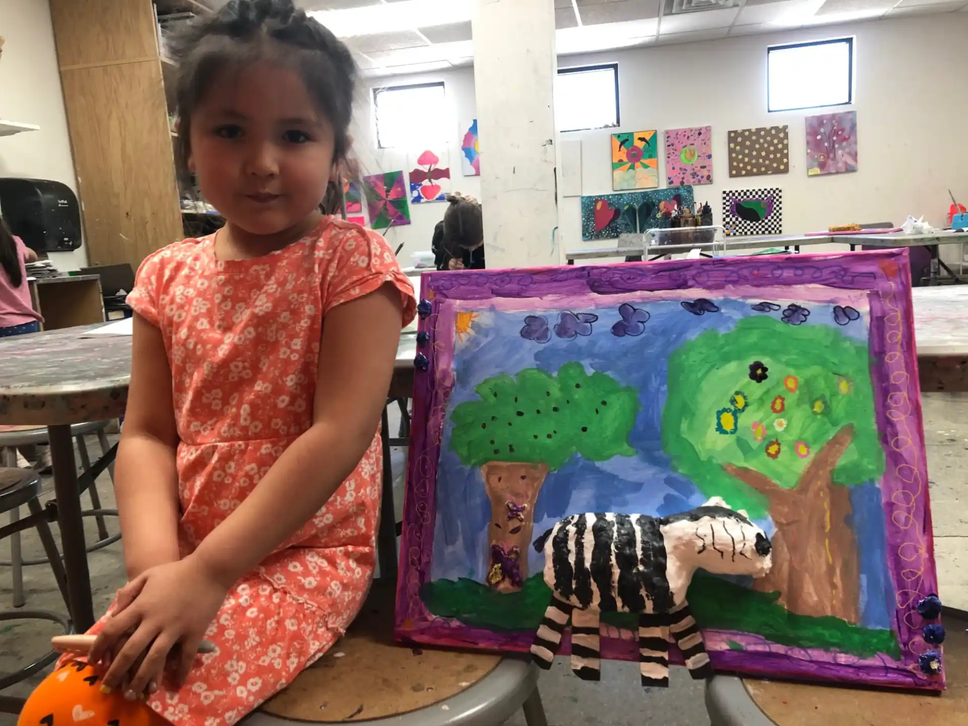 a girl sitting on a table