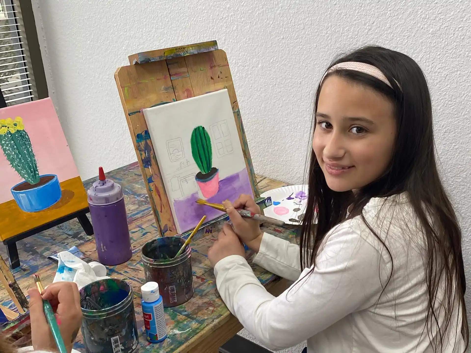 a person painting on a table