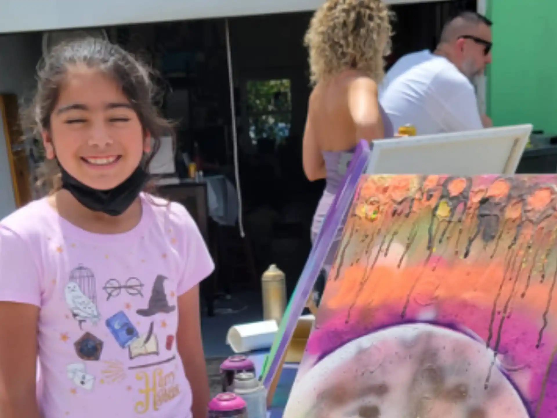 a young girl painting