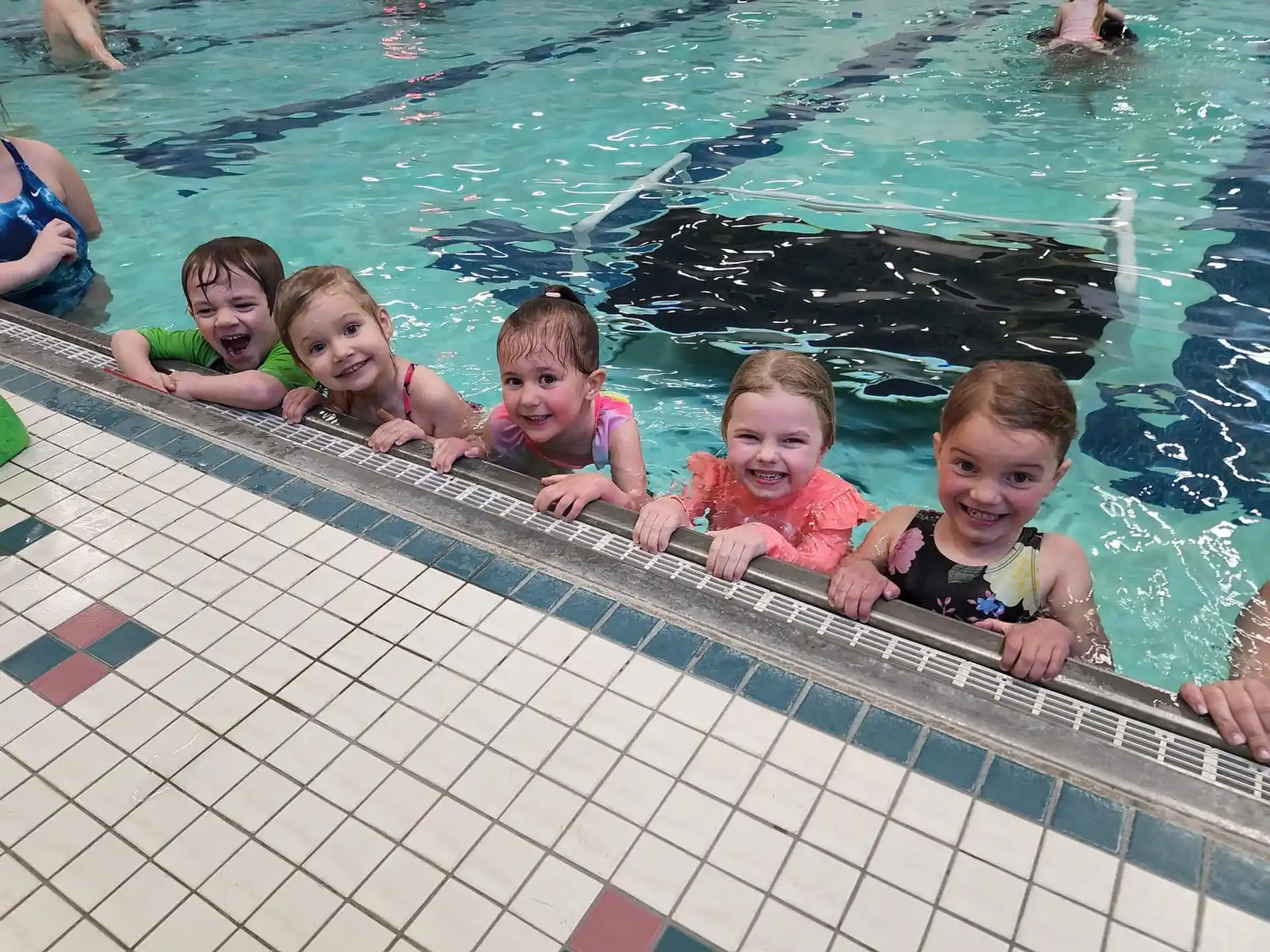 a group of kids in a pool