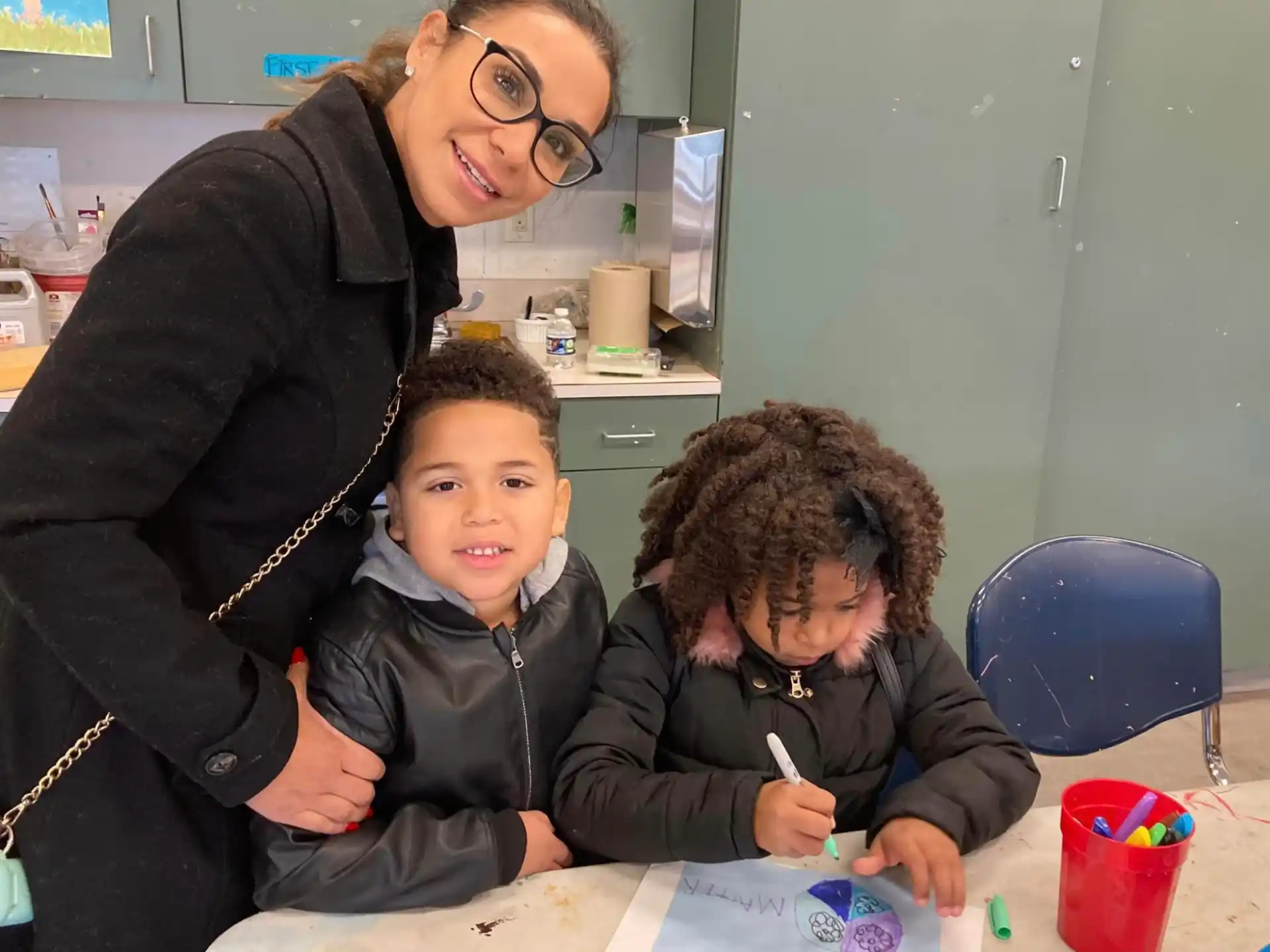 a person and two boys