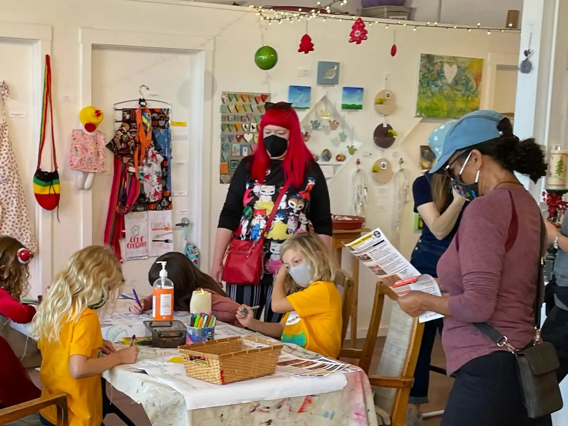 a person reading a book to a group of children