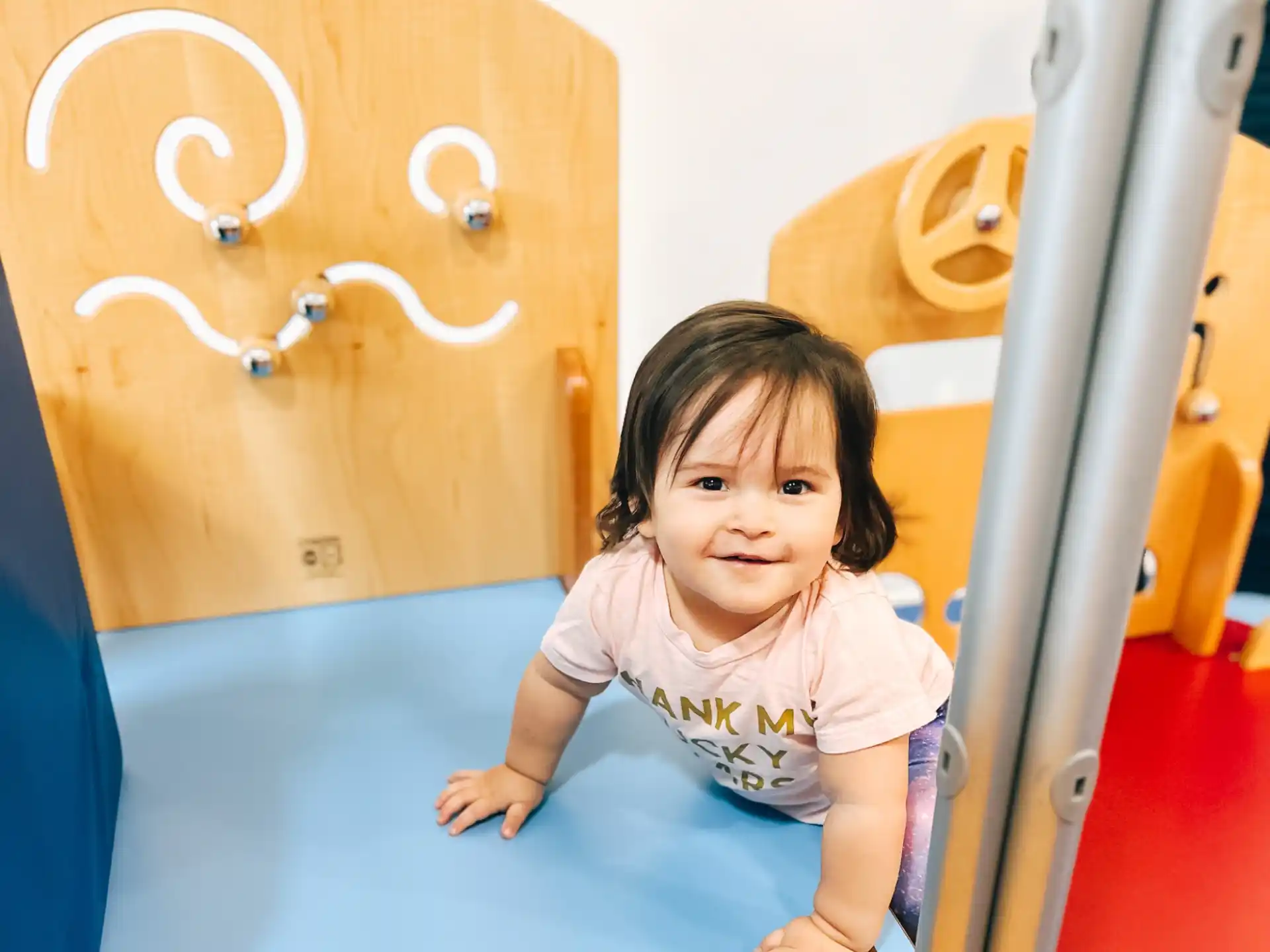 a girl sitting on a slide