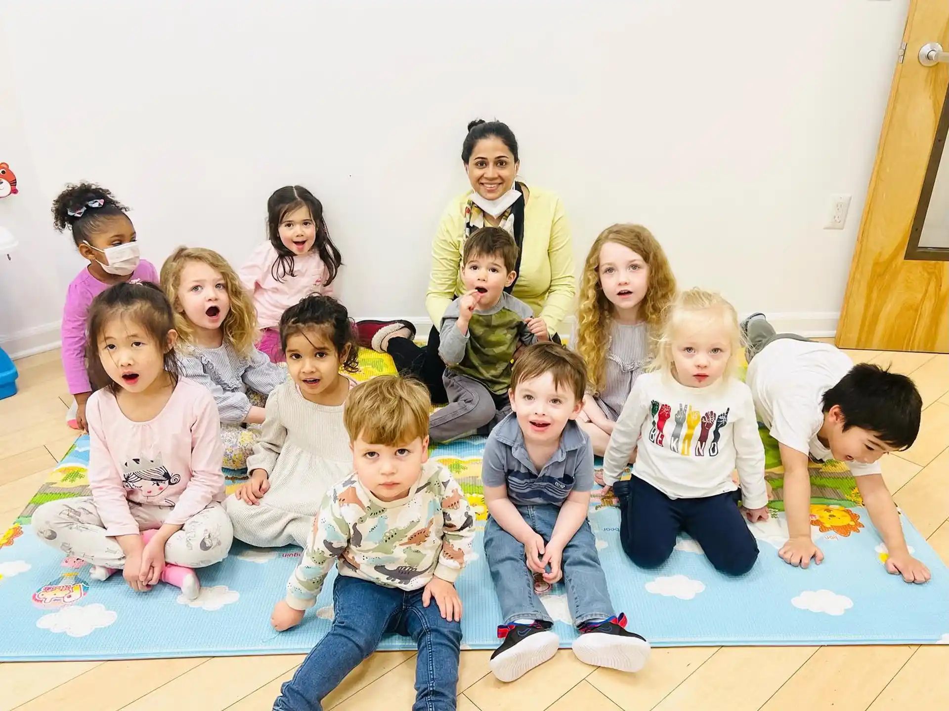 a group of children sitting on the floor
