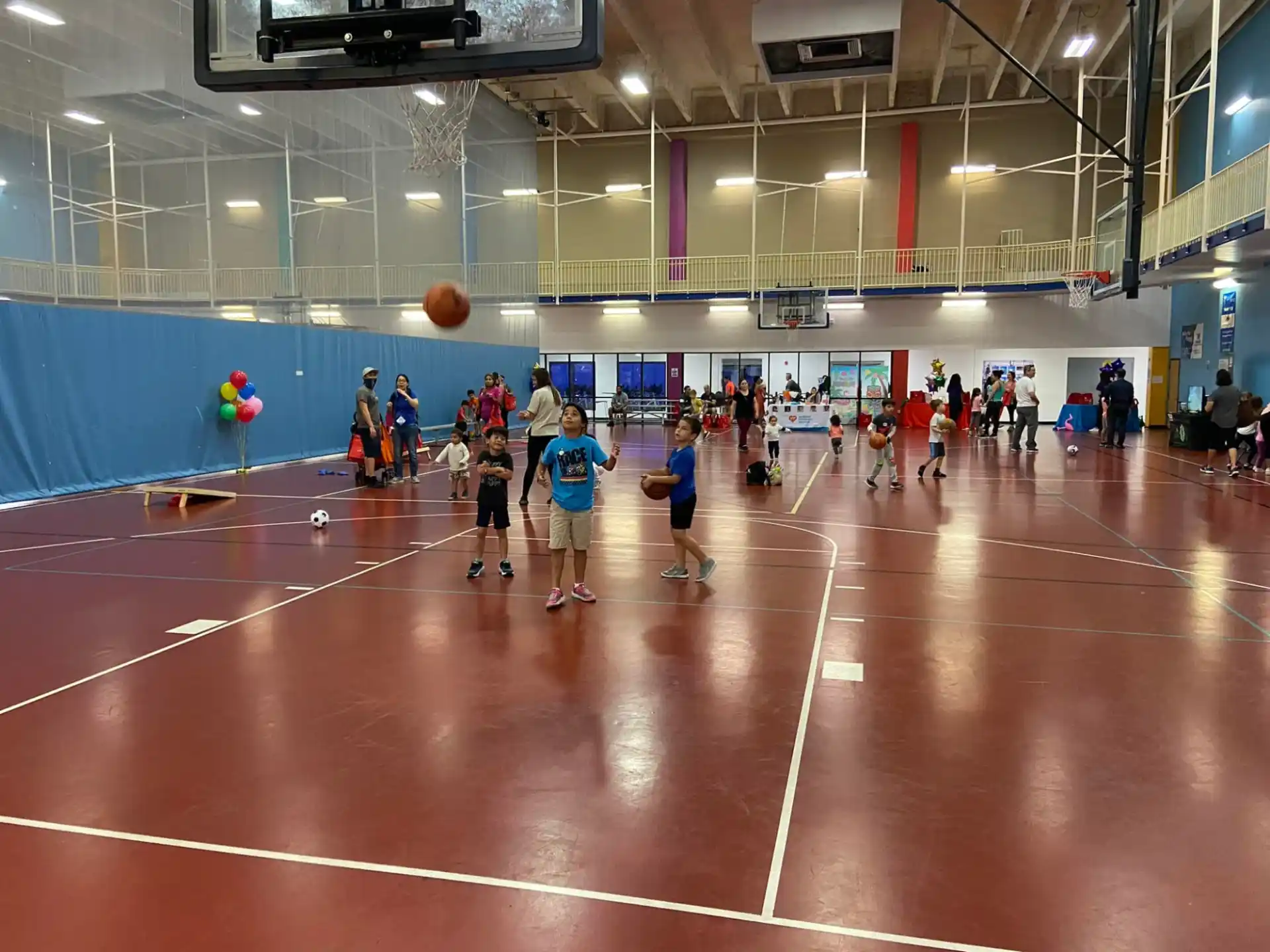 a group of people playing basketball