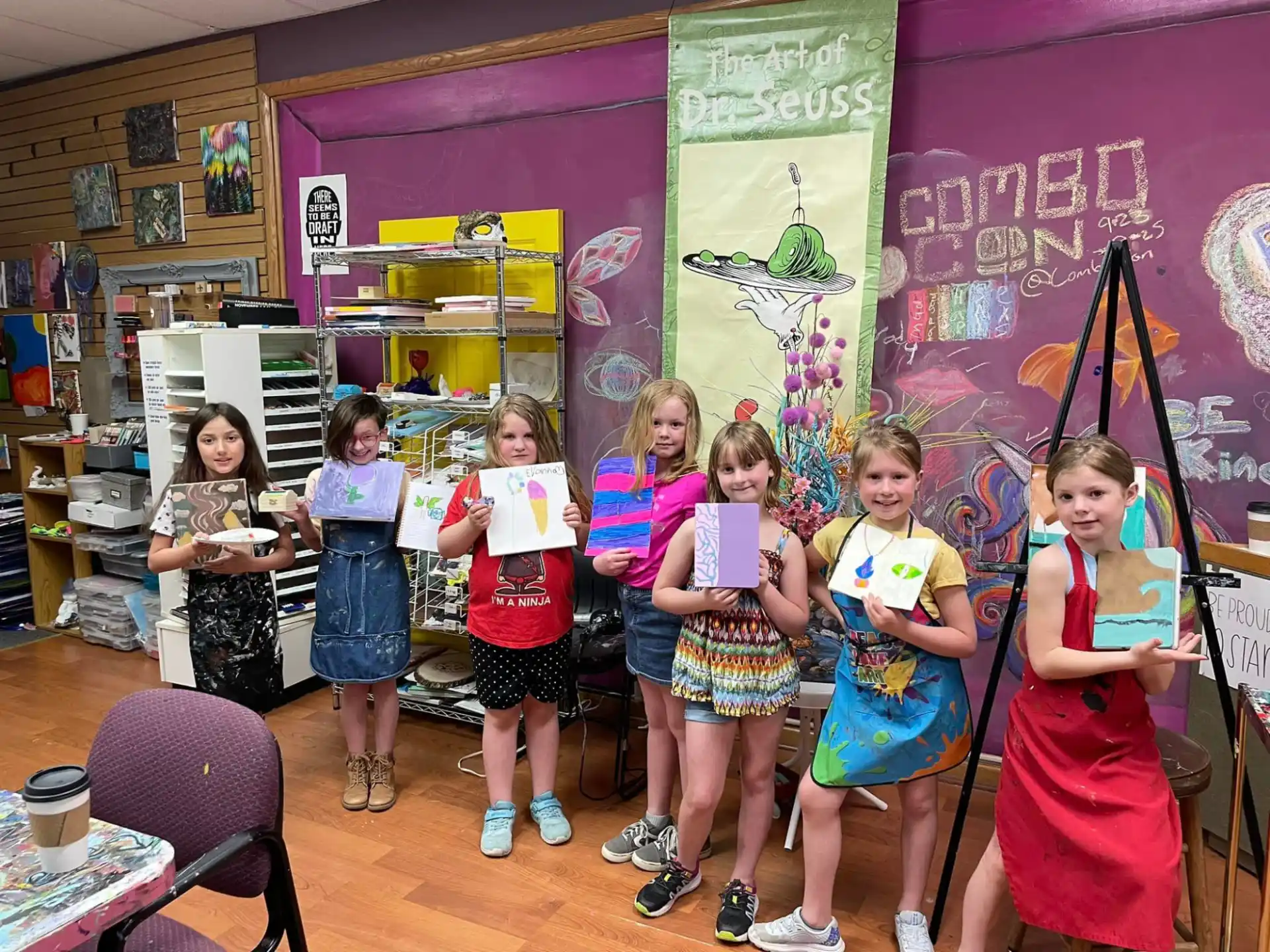 a group of children holding books