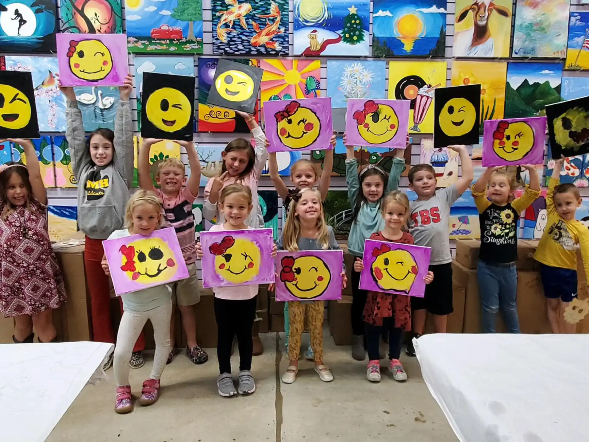 a group of children holding signs