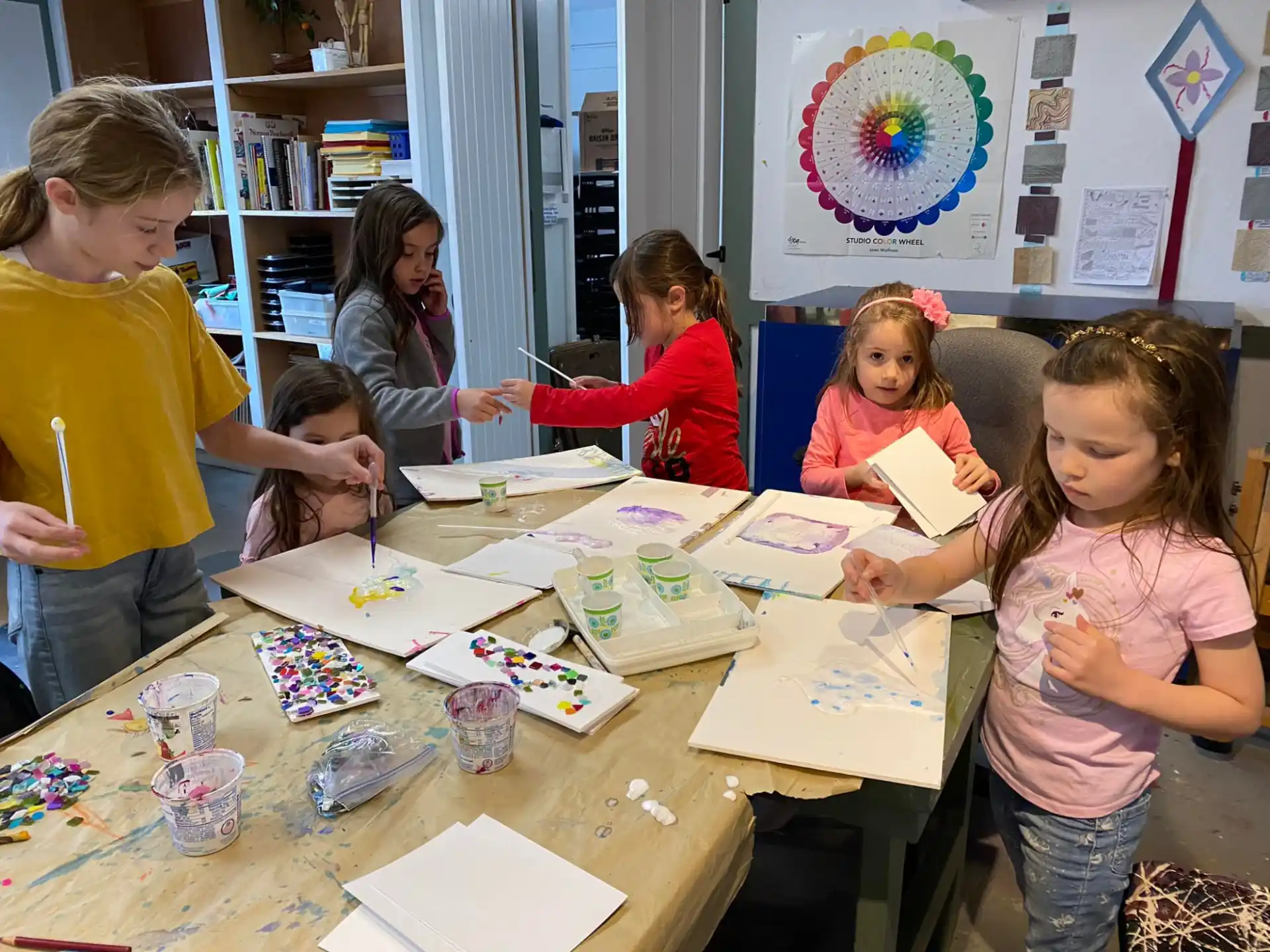 a group of children painting