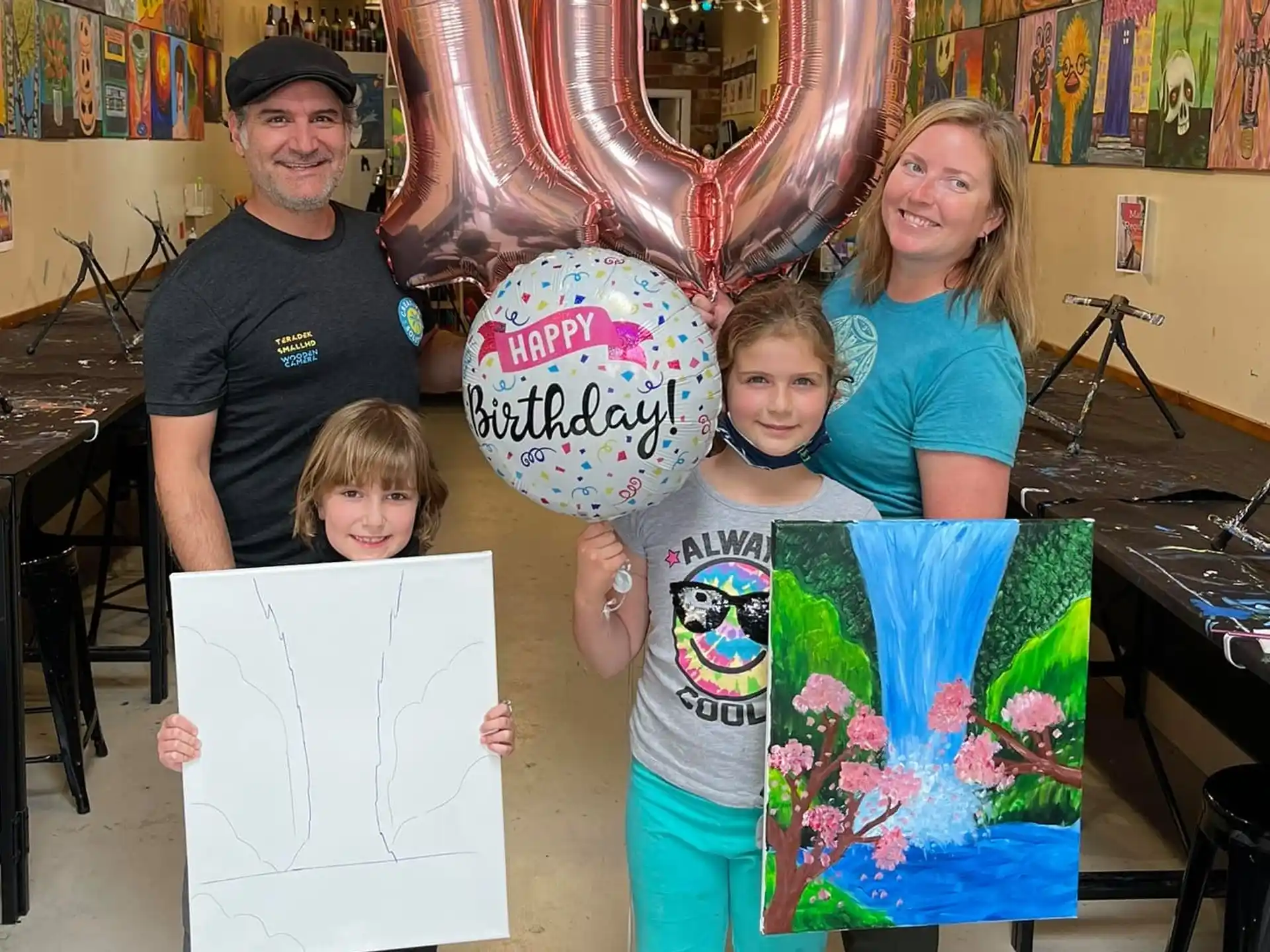 a group of people holding a drawing