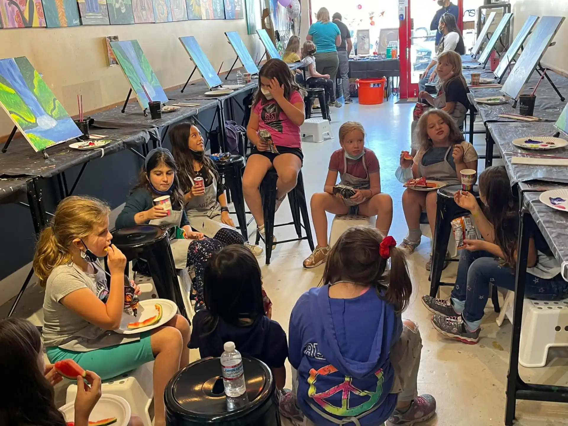 a group of people sitting in a classroom