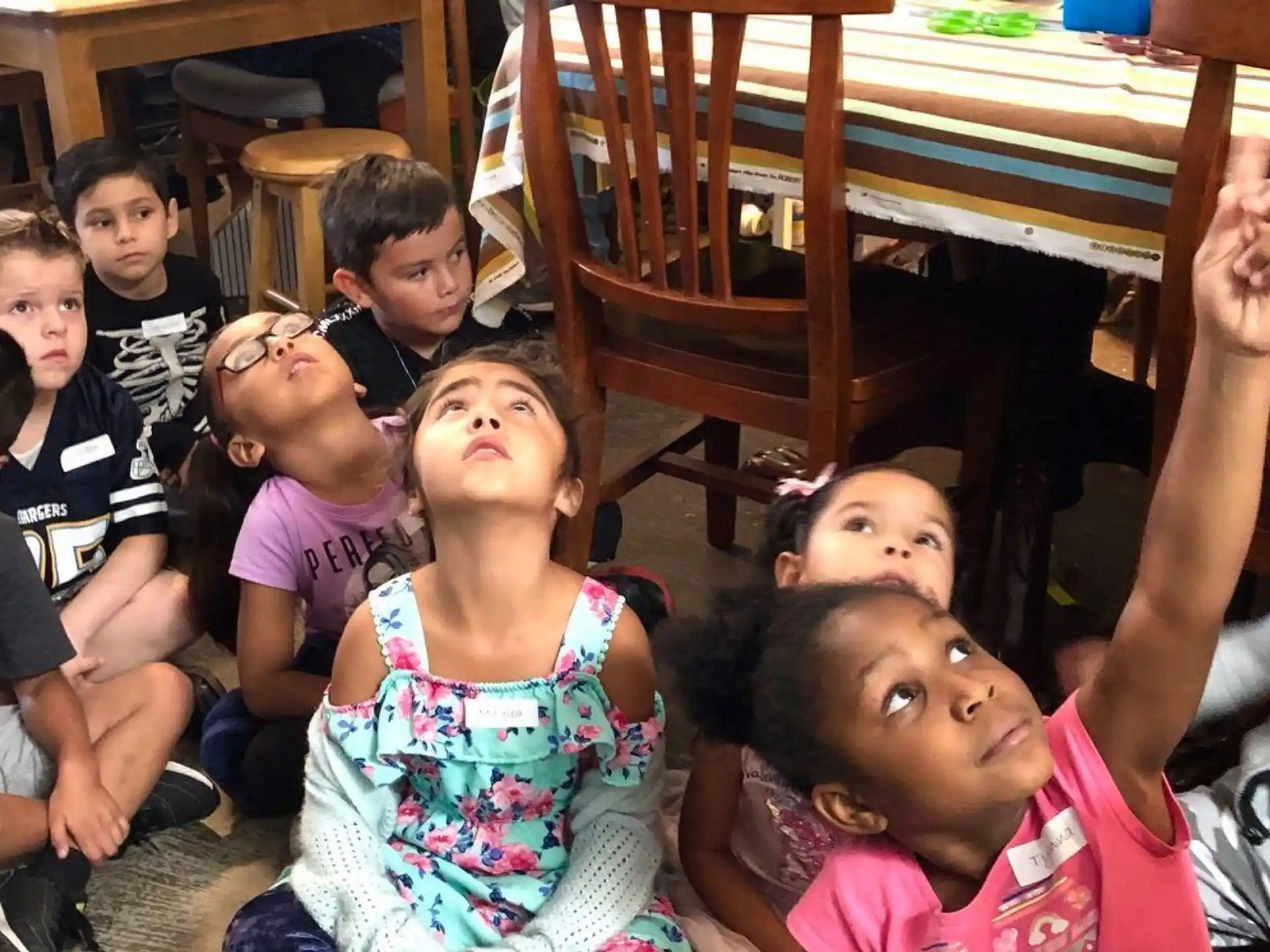 a group of children sitting on the floor