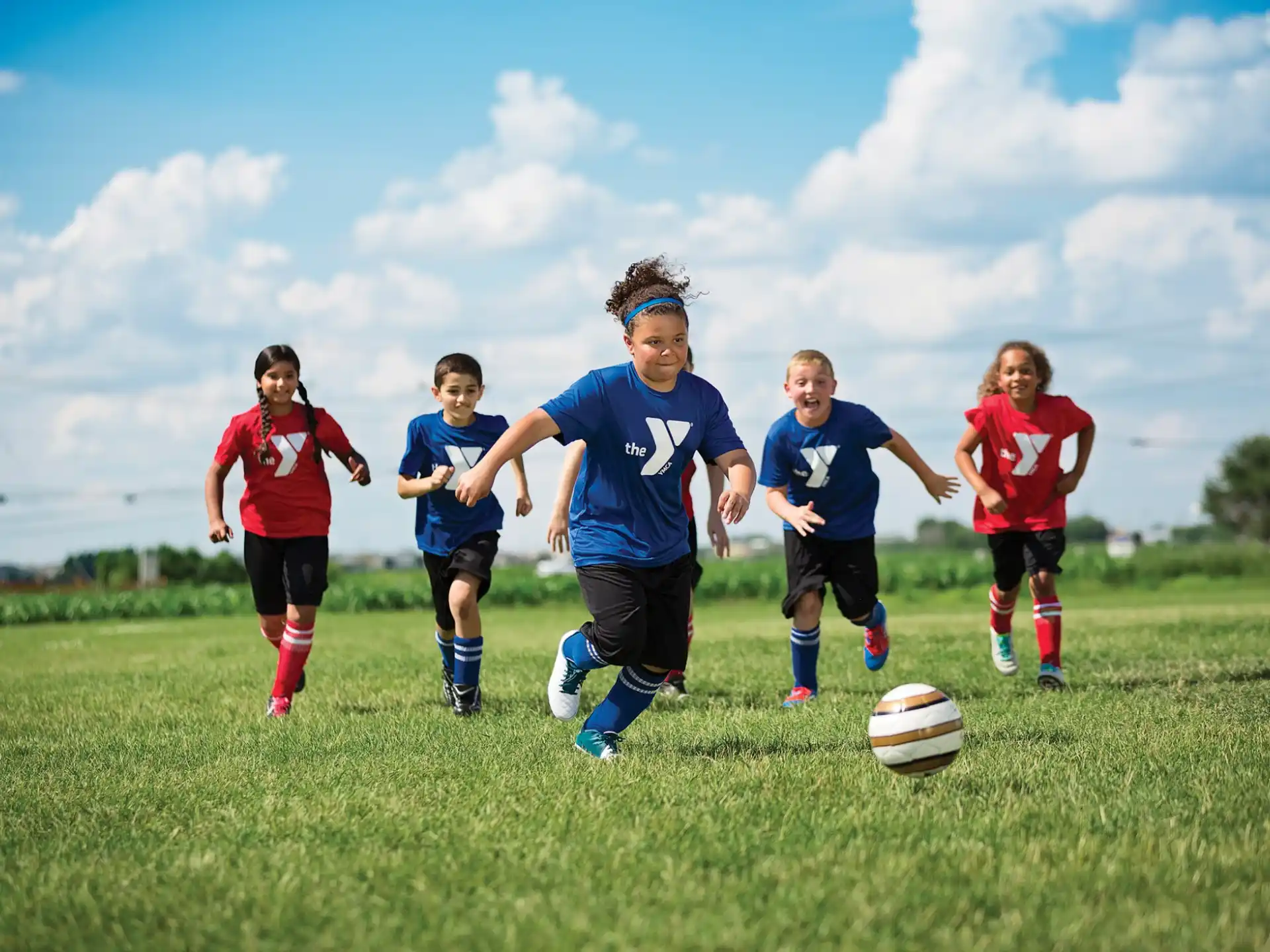 a group of kids playing football