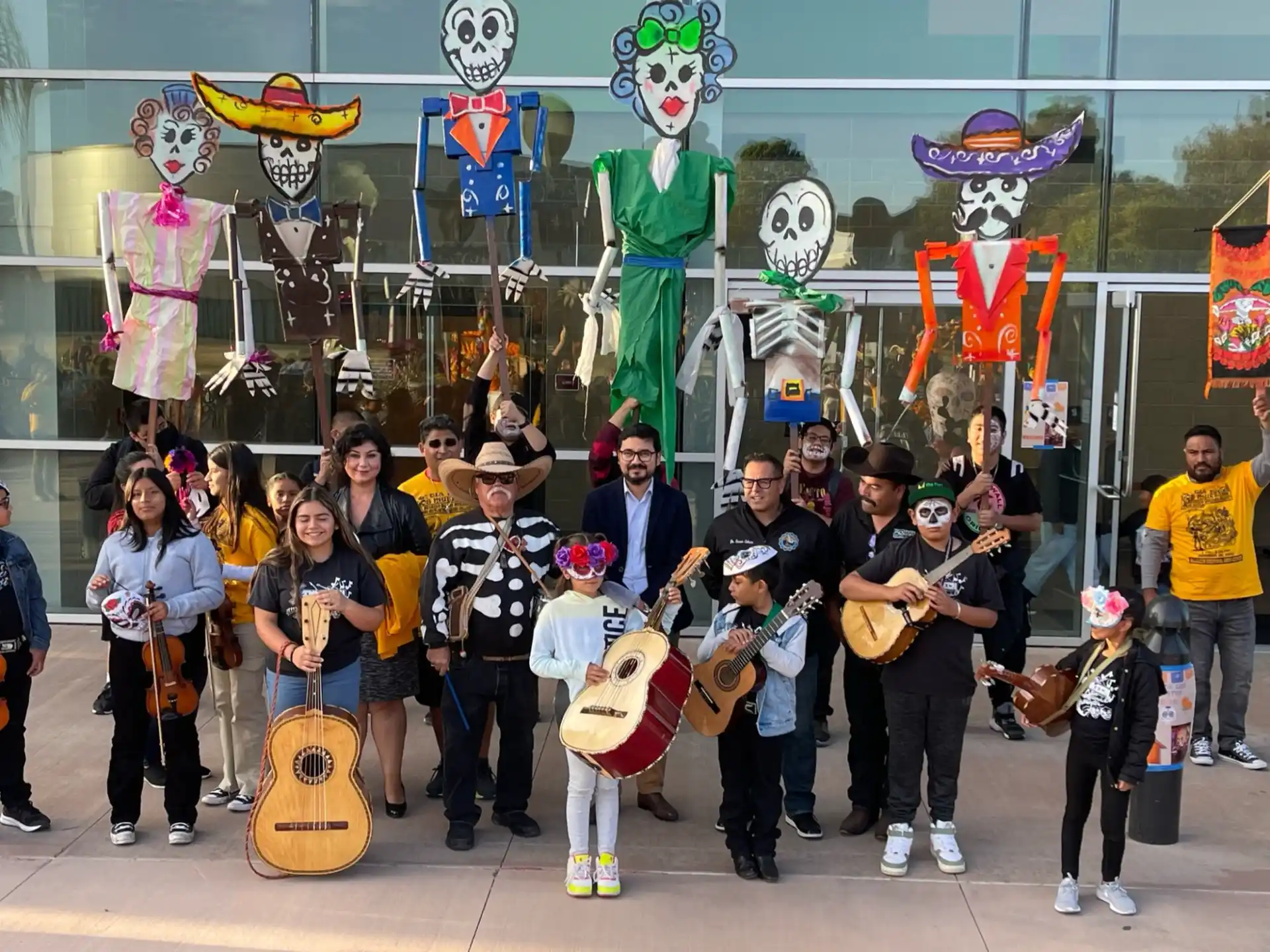 a group of people posing for a photo with musical instruments