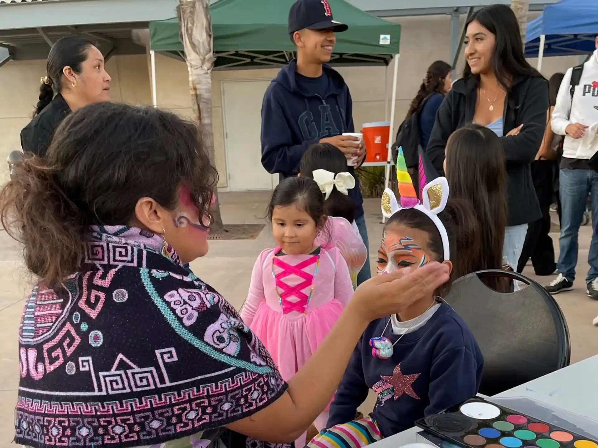 a group of people with paint on their faces
