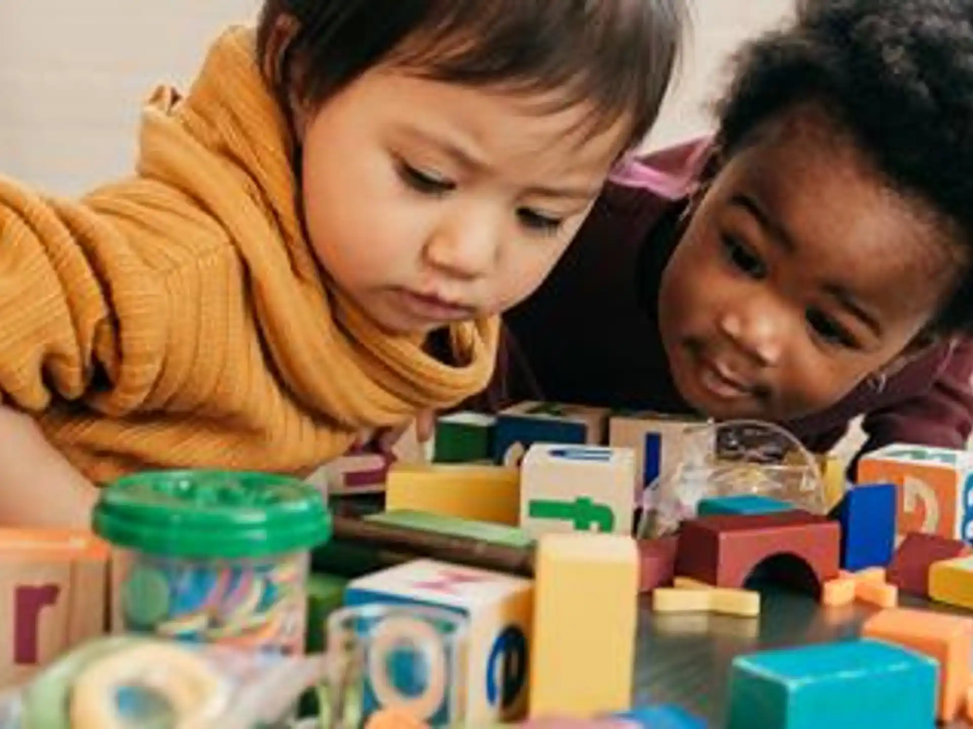 a couple of kids playing with toys