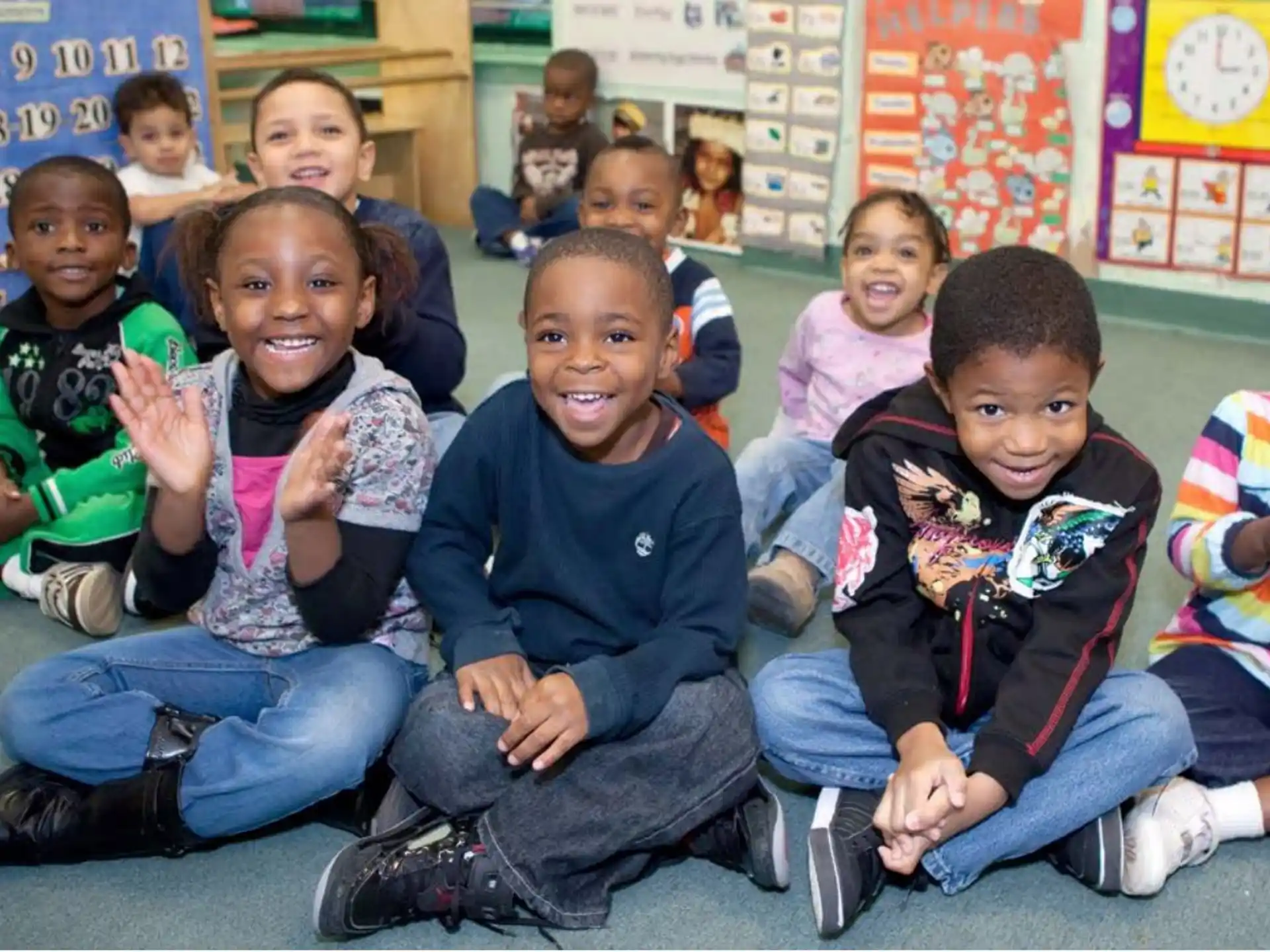 a group of children sitting on the floor
