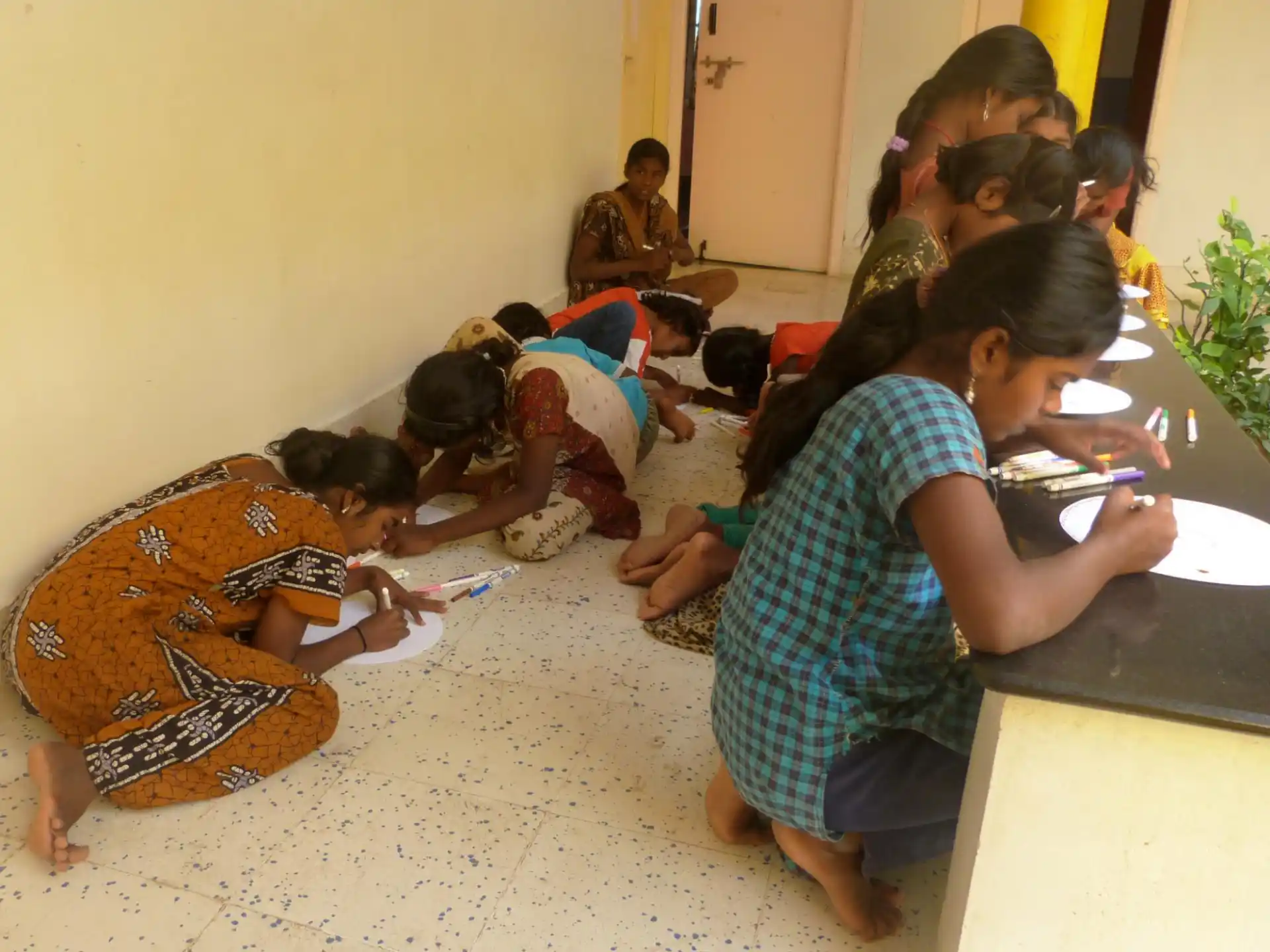 a group of people sitting on the floor