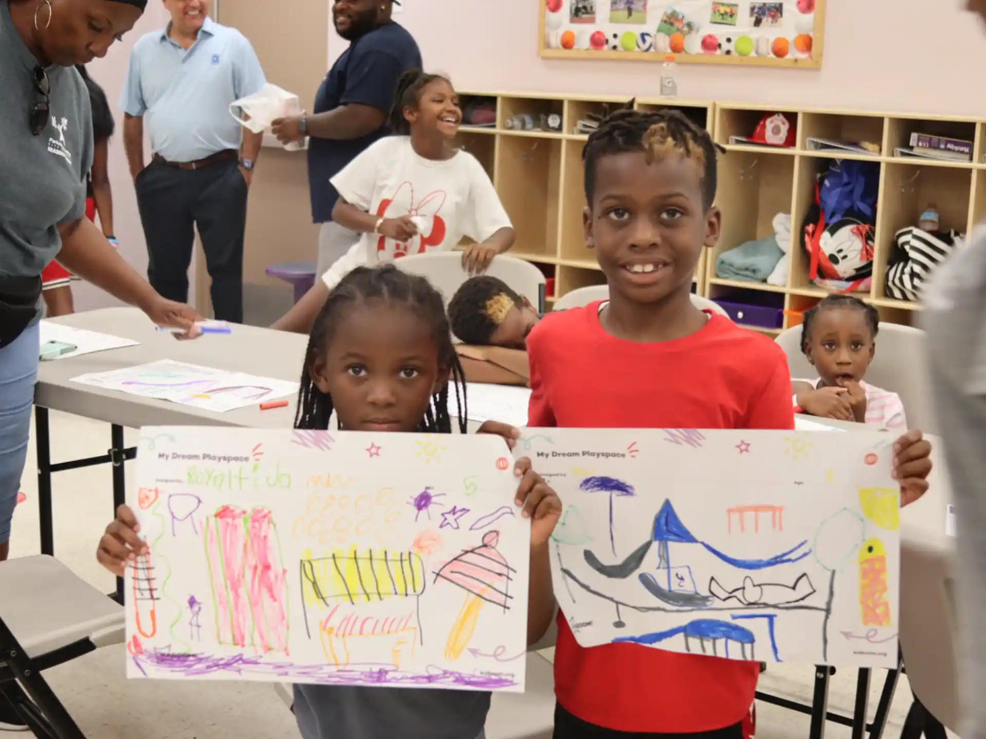 a group of children holding a sign