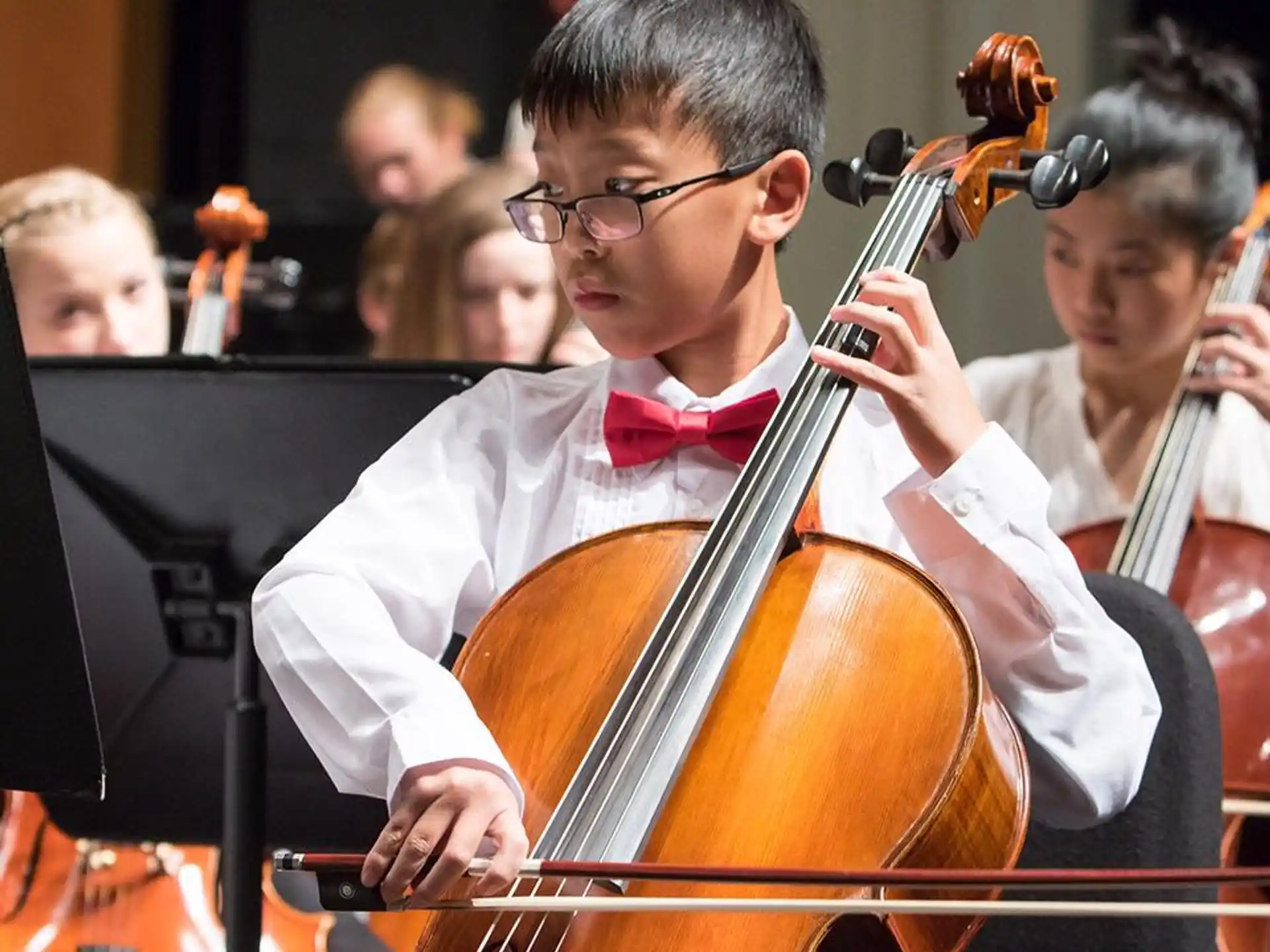 a boy playing a violin