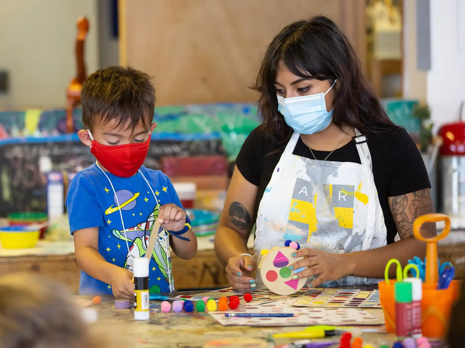 a person and a boy wearing masks