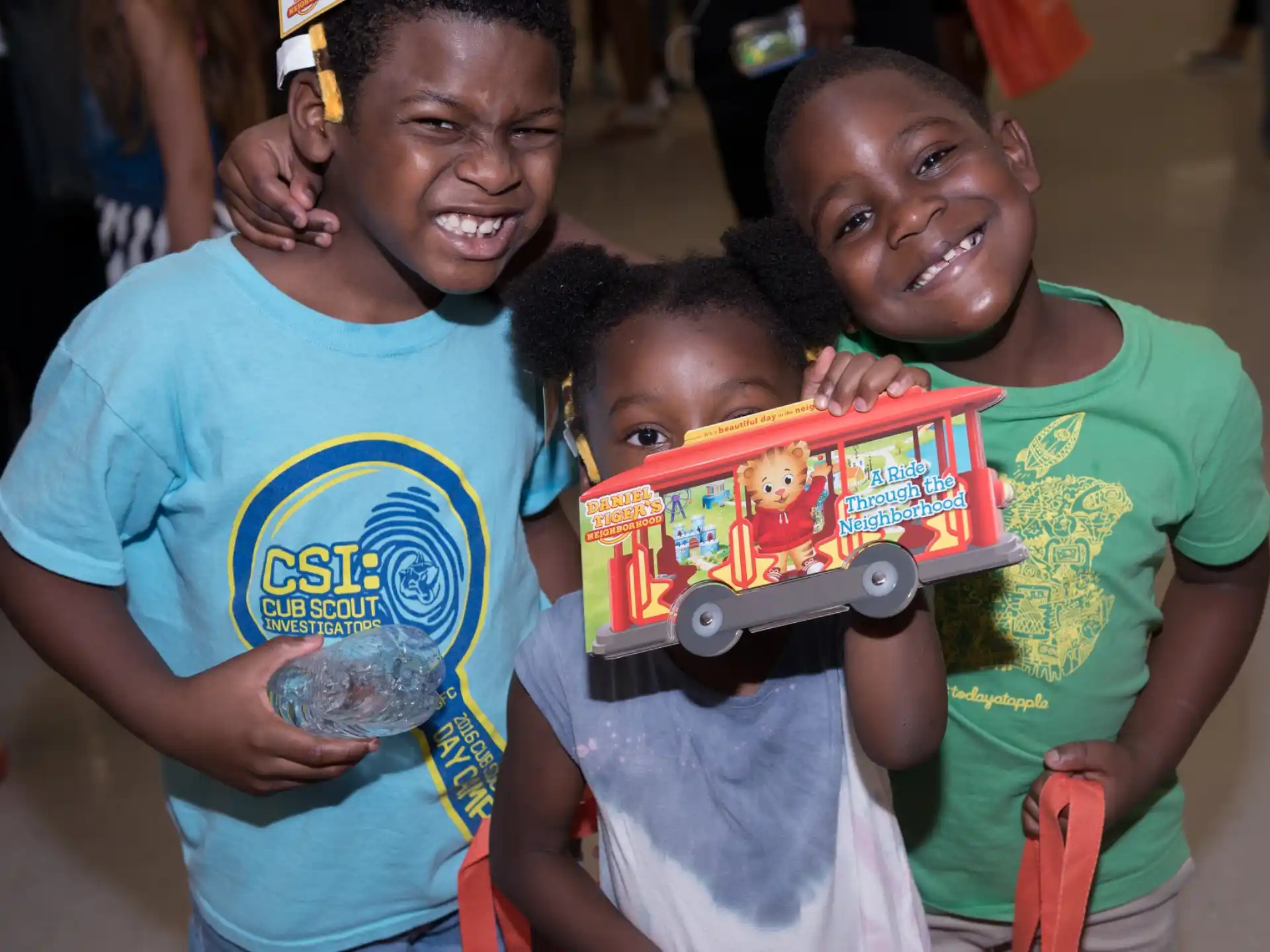a group of kids holding a skateboard