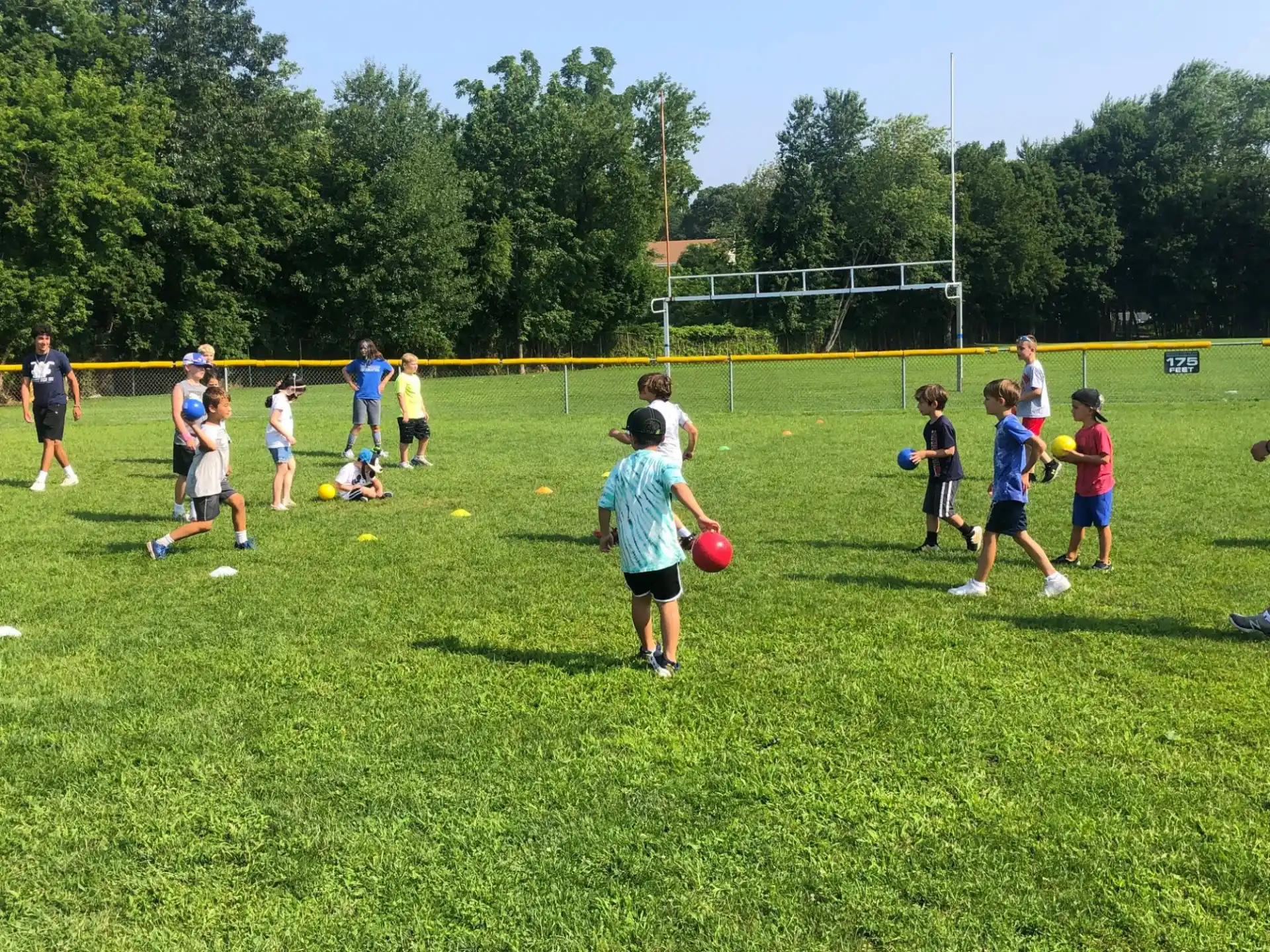 a group of kids playing football