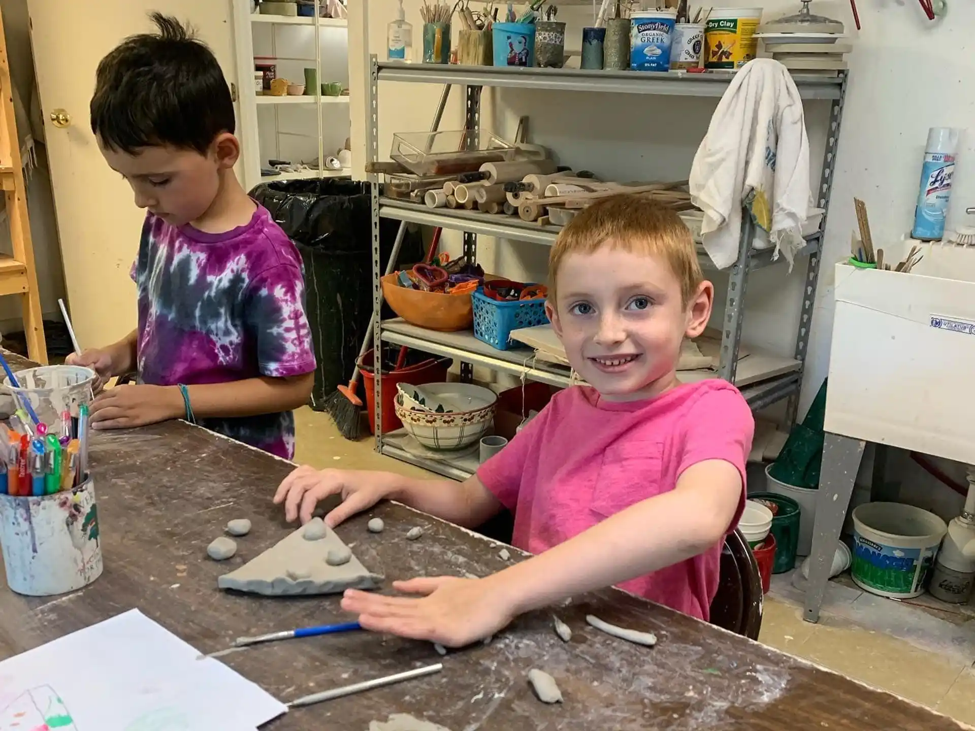 a couple of young children painting