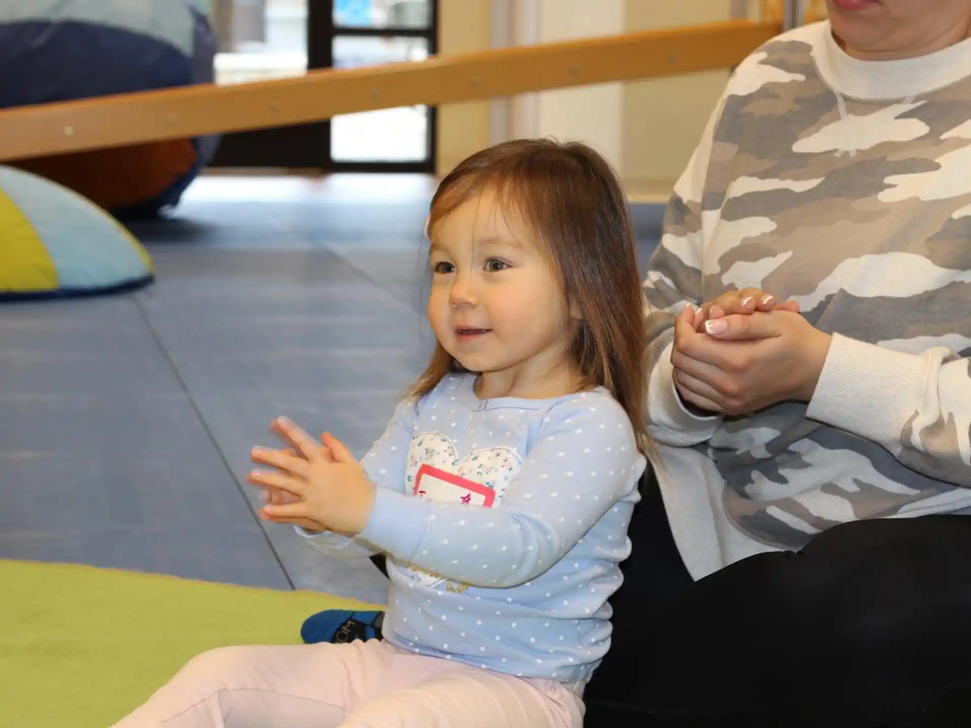 a child sitting on the floor