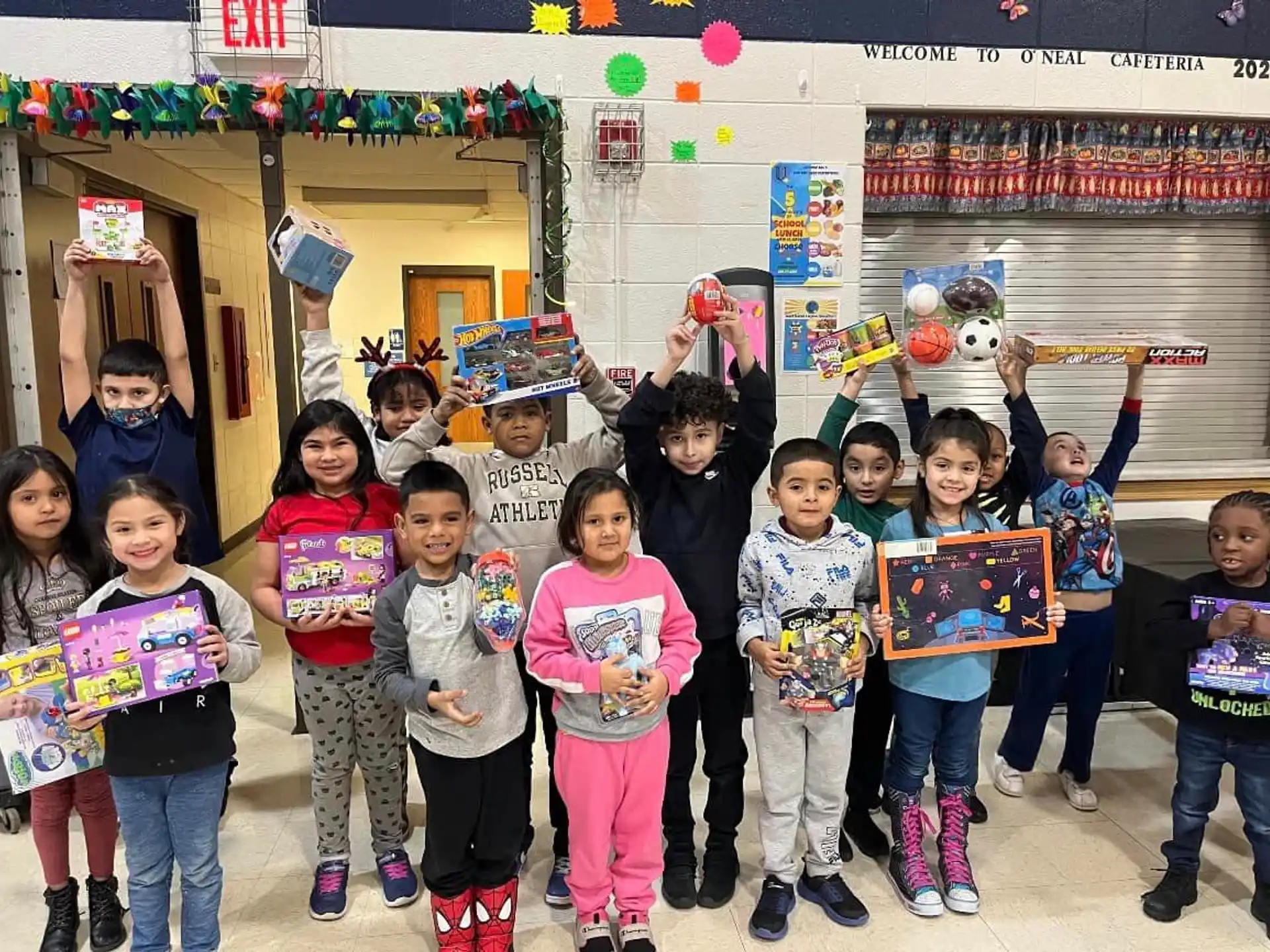a group of children holding signs