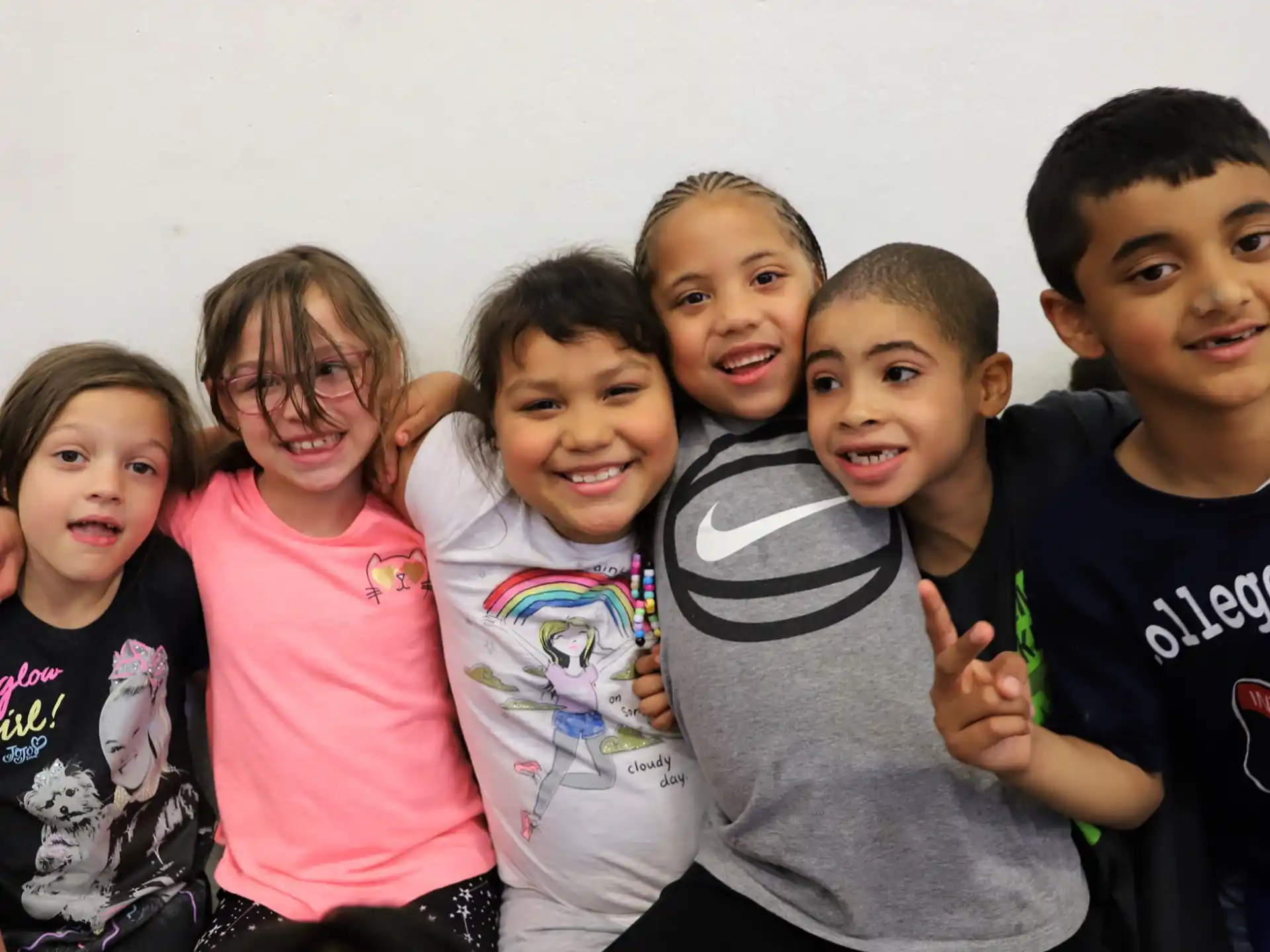 a group of children posing for a photo
