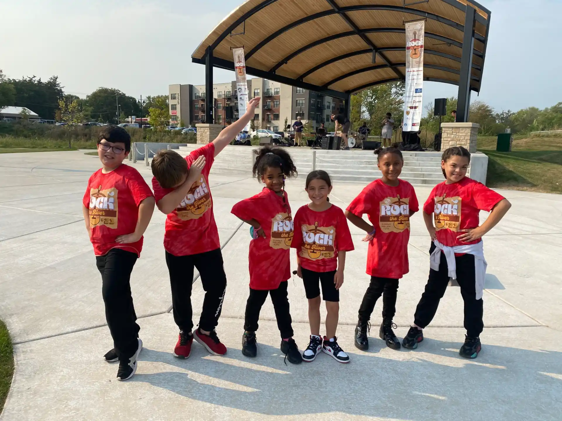 a group of kids posing for a photo