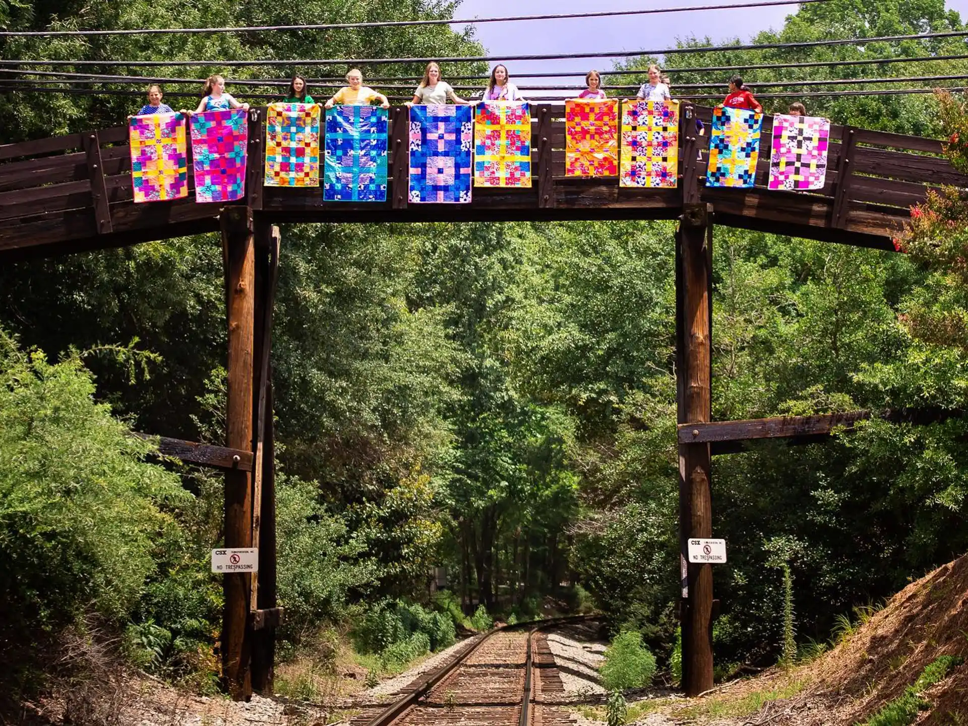 a group of people on a train track