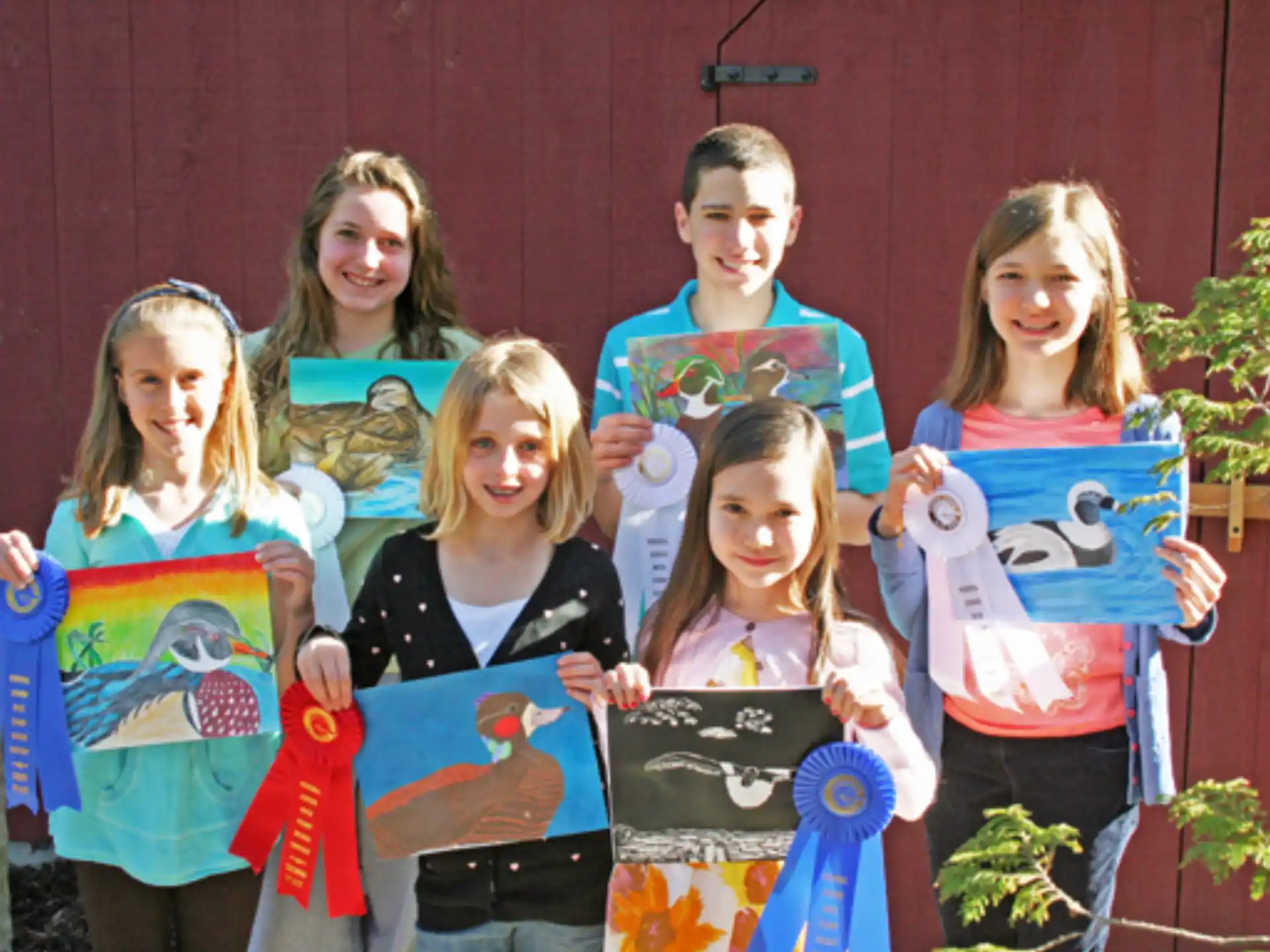 a group of children holding up signs
