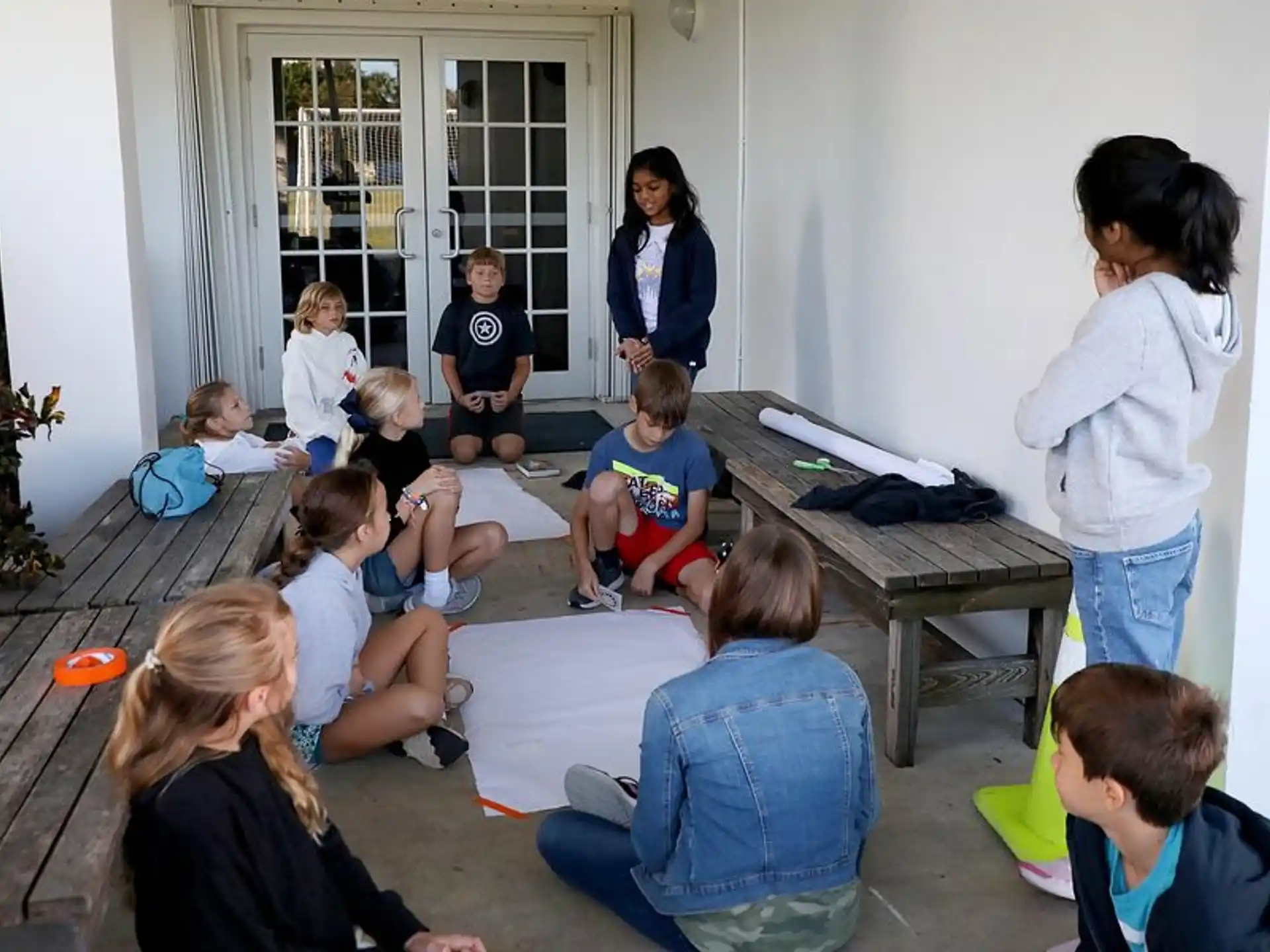 a group of people sitting on the floor