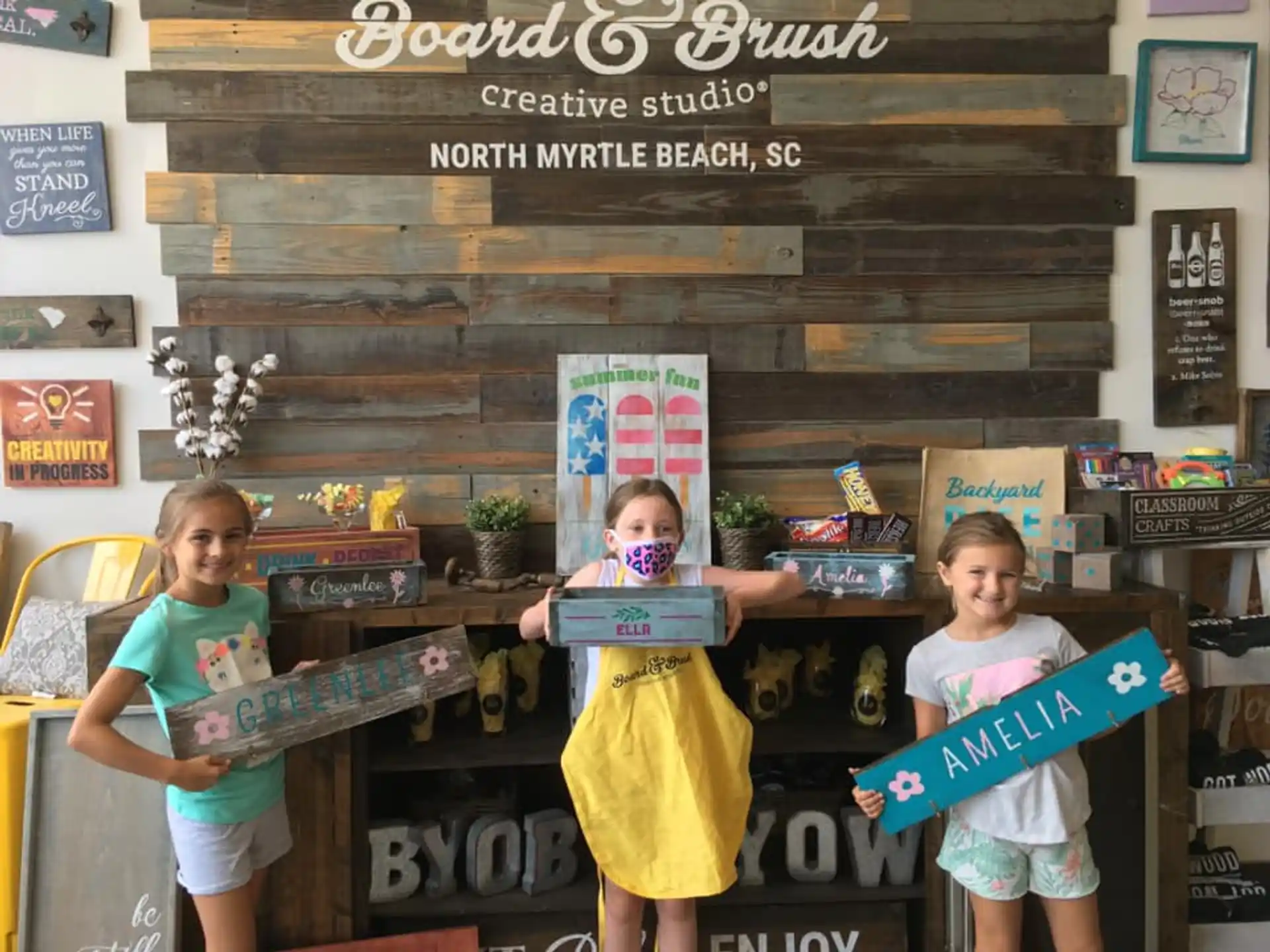 a group of children holding books